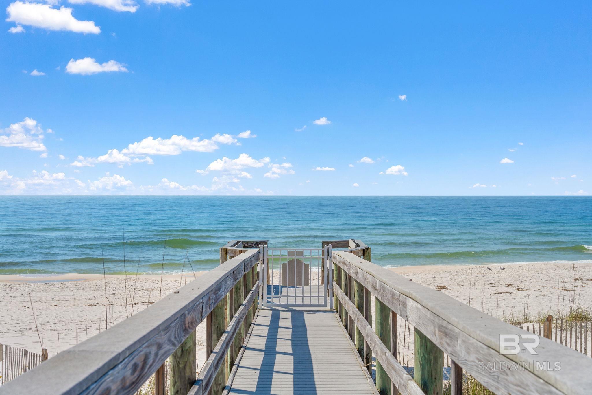 Look no further and spend the rest of your SPRING in PARADISE!  The owner has spared no detail in lovingly maintaining this magnificent gulf view home in the only gulf front single-family community on the Gulf in Perdido Key, Parasol.  Parasol is a RENT-RESTRICTED, gated community situated on 900+ feet of gulf front and this home takes in all the gorgeous vistas that paradise exhibits. Two porches overlook the gulf and your walkway to the beach. The pool is just steps away along the pink sidewalk just outside the white picket fence surrounding the home.  The home is being sold FULLY FURNISHED, and ready for you to make it your own. From the beautiful wood flooring throughout the home, recessed lighting, neutral paint and fixtures, tilework, and gorgeous granite, you can see the quality and detail that has been put into this home.  This home has a fireplace in the living room and master bedroom, elevator to all 3 floors, metal roof, hardi-plank siding, hurricane shutters, granite counters in the kitchen and baths, two water heaters were installed 8/9/2018, two HVAC systems installed 6/12/20, and a NEW SPLIT AC SYSTEM are just a few of the great qualities of this beach view home. The kitchen has large island bar area perfect for entertaining as home has open floor plan.  Large master bedroom with fireplace and heated jacuzzi tub in master bath, plus huge walk-in closet.  There is a perfect get away room downstairs that would make a perfect art studio, office, or media room with heating and cooling! Book your appointment today, and don't let this one get away!