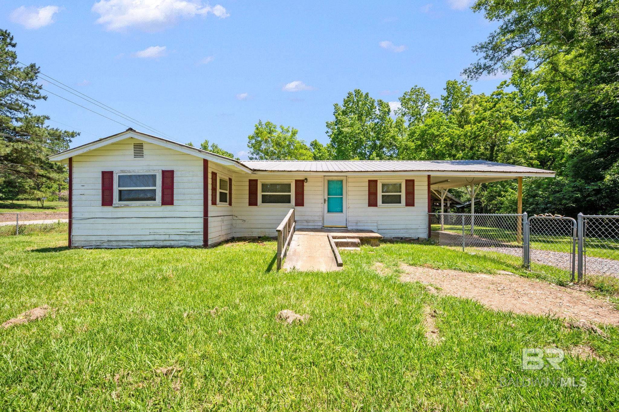Great investment opportunity and priced to move! Situated on a nice corner lot, this 3/1 home features an open kitchen, separate dining room, living area, new vinyl plank flooring, fenced back yard and single carport! Great for a rental! Home will not qualify for FHA, VA, or USDA.