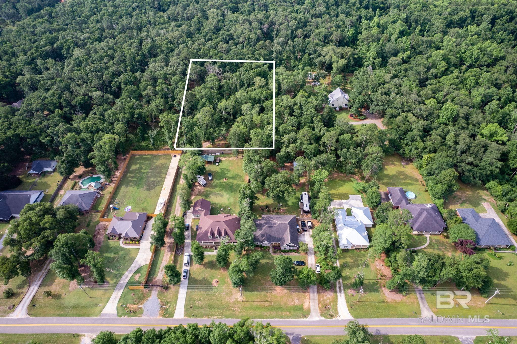 Build your dream home on this 1.68 acres in Fairhope's Hideaway subdivision. There are 3 lots total in this quaint subdivision. 1800 sq ft minimum house. Deeded easement on North side of Lot 3 to access Lots 1 & 2. City water available. Water line has been installed. Septic system will be required to build a house. There is a fire hydrant in front of gate. There is also a security gate with 2 keypads as you enter Cary Lane. Buyer to verify all information during due diligence. All information is deemed reliable and accurate.