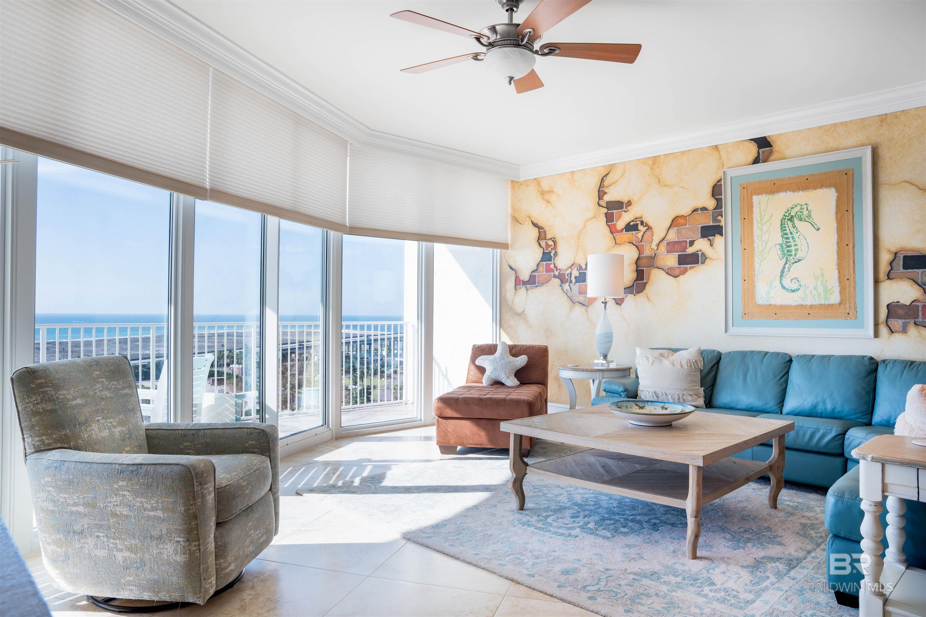 Tiled living room with crown molding, a ceiling fan, and floor to ceiling windows