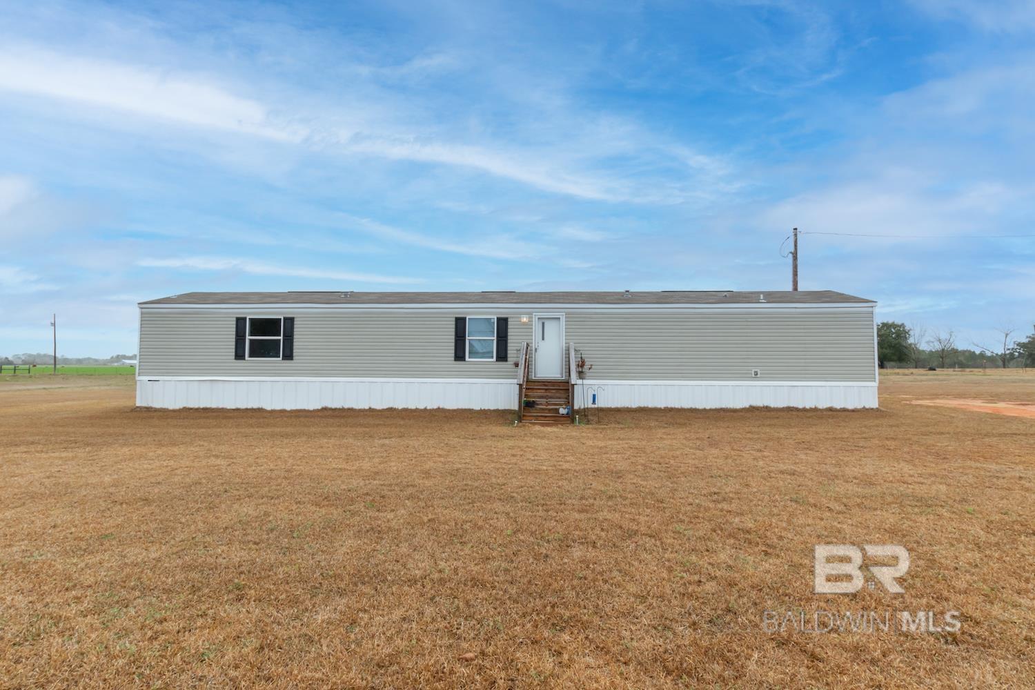 Country living at its finest! Don't miss the opportunity to own your piece of beautiful Baldwin County with this three bedroom, two bath, 1,219 sf Clayton Victory mobile home manufactured in 2019. Home is situated on 2.13 acres with incredible views in every direction! Enjoy the convenience of living just south of Highway 90, connecting Pensacola, FL to the Eastern Shore of Alabama and a short drive to the sandy, white beaches of southern Baldwin County!