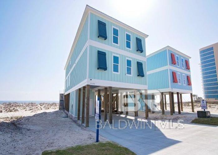 Welcome to "Orange Beach East" raised beach cottage! This 8bdrm/7.5bth home is a rare find in Orange Beach and offers a tremendous rental history, sleeping up to 32 guests! Built in 2017, this home is "Gold Fortified" offering all the latest amenities for its clients.... shiplap accent walls, SS appliances, 2 frigs, 2 dishwashers, 2 ranges, large dining table with seating to accommodate guests, LVP flooring, beautiful tiled bathrooms, bunk rooms for the kids, flat screen TVs, several guest suites offer private gulf front balconies, main living room is large and spacious for guests to spread out, 2nd level Living Area is perfect for the kids to have movie night, elevator, outdoor pool w/ heater, grilling area downstairs and so much more! This homes rental history was incredible 2021 and looking even better for 2022! Rental history is available upon request.