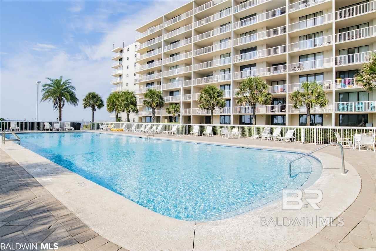 Stunning top floor, 3 bed 2 bath, corner unit with wrap around balcony. This unit offers incredible views of the Gulf and the pool. This complex has all the amenities to attract rentals - 2 large outdoor pools, indoor pool, tennis courts, grill stations, sauna, extreme landscaping & huge beach area. The balcony extends the living room and master, with extra around the corner wraparound. Granite kitchen, tile floors.