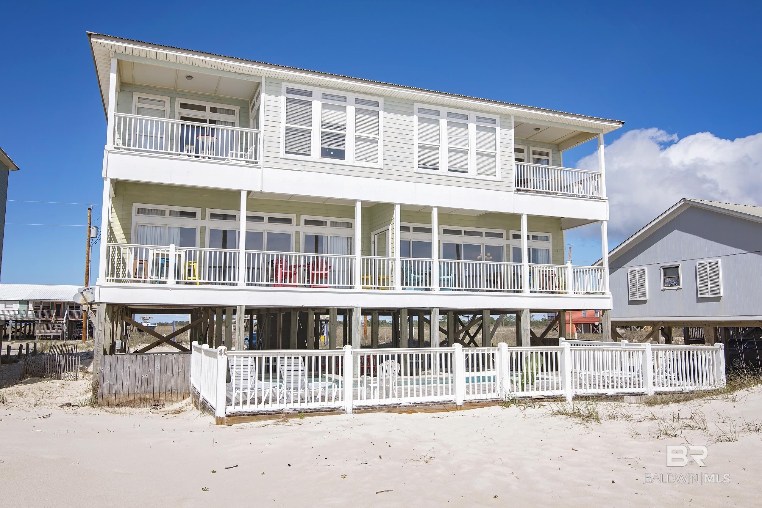 If you are looking for a vacation home for large families or if you're looking for an investment property, look no further than Big Breezy on Fort Morgan.  Big Breezy is a large 10 bedroom, 6 bath, 2 half bath house that is over 5,800 SF, has a private pool, and sits directly on the white sandy beaches overlooking the crystal blue water of the Gulf of Mexico.  Current rentals for 2022 are $270K plus with a target finish of $300,000 in gross rental revenue.  This home sleeps up to 30 so please allow time for showing requests and it is best to show between turn arounds during Summer (Sundays, between 10 am and 4 pm).  All 2022 rentals to be honored.  All information, measurements, details, etc. are not to be deemed reliable and to be verified by buyers' and/or buyers' agents.