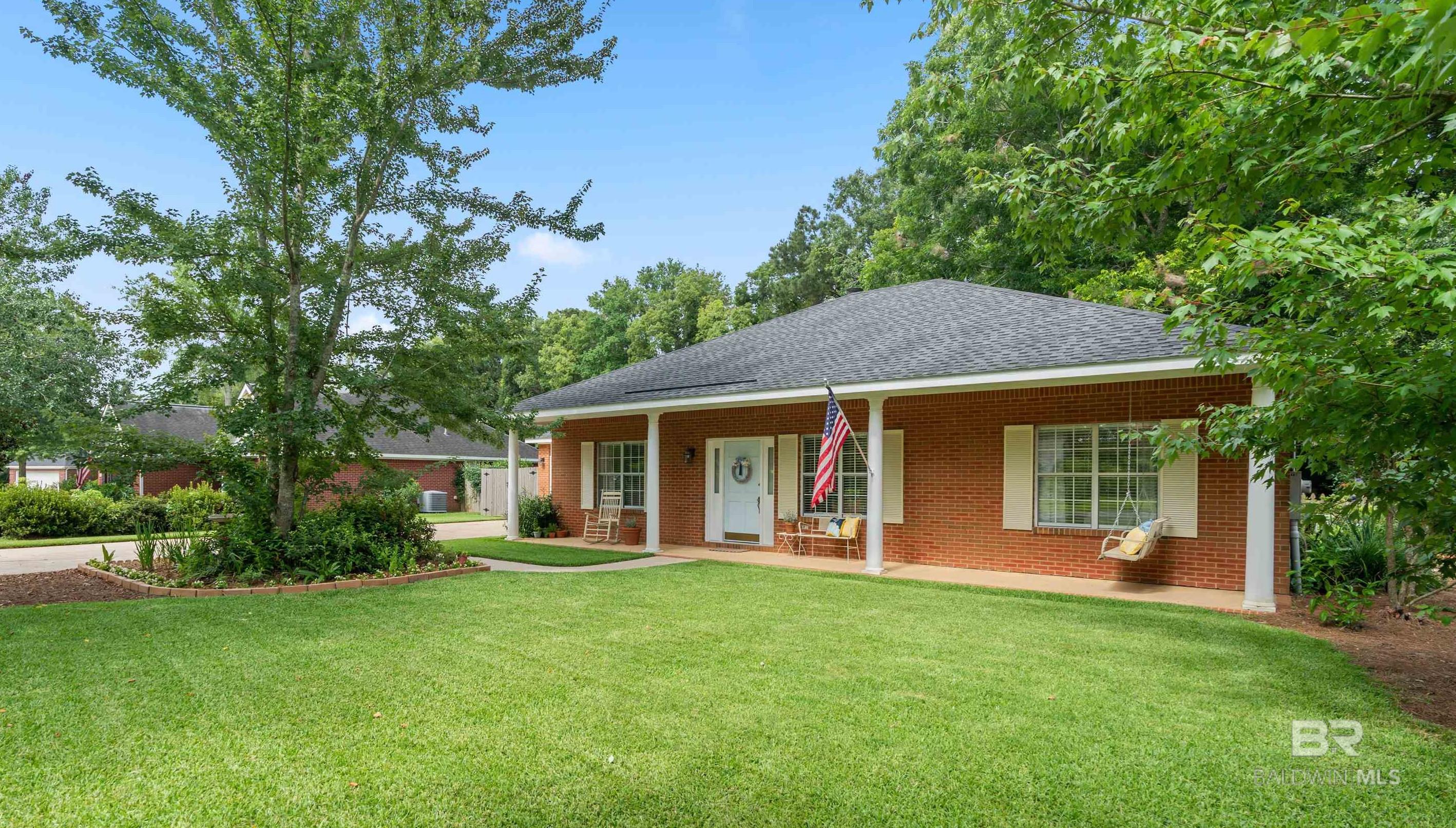 Welcome Home! This classic, well-maintained brick home in a small neighborhood located between Hwy 98 and Hwy 181 could be your next Home Sweet Home. The beauty starts with the curb appeal thanks to the wide covered front porch and the mature landscaping. Inside you will find fresh paint, beautiful parquet floors, and brand new carpet in the bedrooms. The Bronze fortified roof is only 5 years old! Need space? In addition to the 3 bedrooms and 2 full baths, this home also has a spacious living room, a bonus room, and a sunroom. Enjoy your morning coffee from the sunroom just off the spacious kitchen and overlooking the private, fenced backyard. Additional perks include the vaulted ceilings, split floorplan, and the adorable back deck. Parking will not be an issue due to the 2 car attached garage and room for more cars in the driveway. White Grove is a quaint neighborhood with mature trees and sidewalks ideal for an evening stroll. It is conveniently located only a mile from Wal-Mart and just 4 miles from the local shopping and dining of Downtown Fairhope. Call your favorite realtor to see this before it's gone. All information is deemed reliable but must be confirmed by buyer.