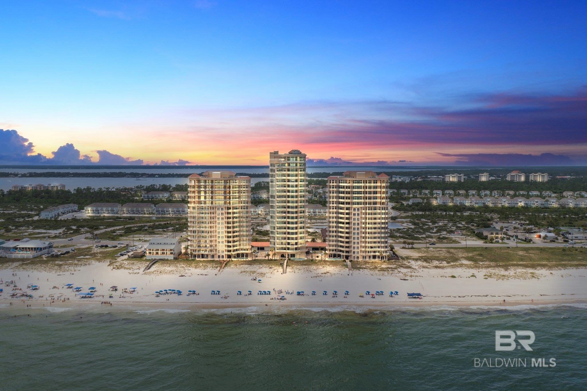 Now offering a one-of-a-kind penthouse with uncompromising quality at Perdido Key's most pristine, luxury Gulf-front condominium, La Riva. This low- density condominium complex is exceptionally private for its owners and owner's guests. This penthouse unit has unparalleled unobstructed panoramic views of miles of the Gulf of Mexico and the beaches of Perdido Key. The immaculately furnished 5-bedroom + BUNK ROOM, 4.5-bath haven presents an abundance of natural light, chef’s kitchen and spacious outdoor living areas – The finest luxury interior and gorgeous open floor plan to encompass only the best views from the 15th floor of all Perdido Key, offering floor to ceiling impact-resistant glass, high-stretching 11’ ceilings, and 2982sqft of balcony space. In addition to it’s elegant features and furnishings, this residence offers stylish flooring, polished granite countertops, richly custom wood cabinetry, chef’s kitchen, stainless steel appliances, gourmet island, wet bar, wine refrigerator, and great spaces for all of your entertaining needs. La Riva has only 66 units total in the 3-tower complex, with ONLY 25 residences at La Riva West, providing a rare opportunity to enjoy uncrowded beaches. A deeded garage space and storage unit conveys with the property. This private, gated complex is rent-restricted, with no short-term rentals allowed. Each tower at La Riva features its own grand lobby with multiple seating areas, lavish outdoor pool, indoor pool, fitness room, grilling area, game room and expansive beachfront deck. With lush landscaping and the beaches of Perdido Key surrounding your new waterfront abode, you can be sure to expect an exquisite living experience at La Riva #15W. Call today to schedule your private tour!