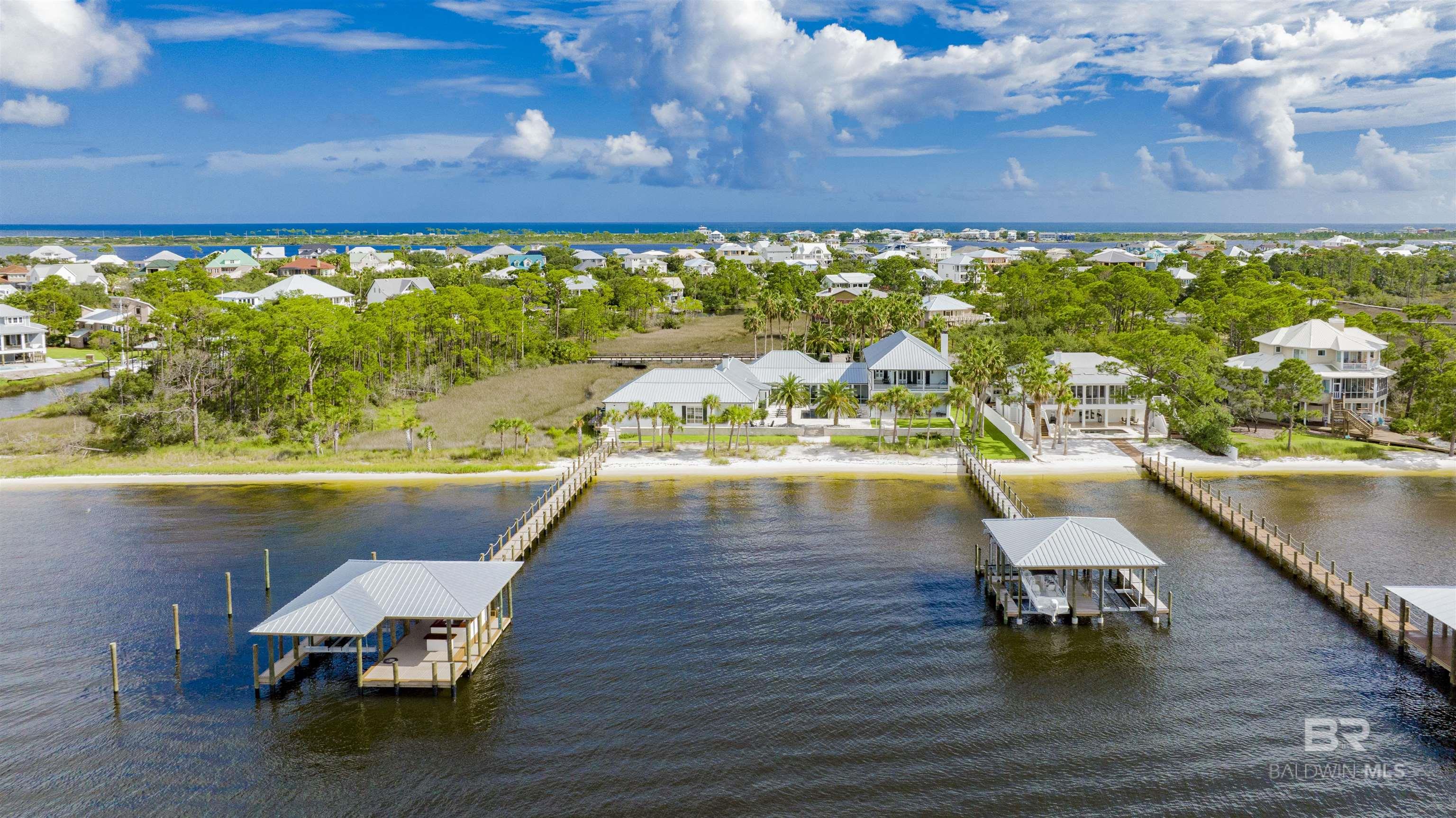We often hear "one of a kind."  This property is truly, "One of a Kind".  Situated on two lots, PPIN numbers 106153 and 99457 (1.85 acres) on deep water by the ICW, is a stunning home that epitomizes luxury, beauty, functionality, durability, and comfort.  From the remarkable kitchen to the pier systems, and the heated and cooled 4 bay garage, there are too many prominent features to detail in this set of remarks.  In documents, you will find "Additional Information."  I think you will find it extremely interesting and worth the read.                                                                                                                                Virtual Tour 1 is a Matterport production.   Copy and paste      https://my.matterport.com/show/?m=bxce89MecQg&brand=0                                                                                                                                                                                                                                         Virtual tour 2 is a drone video.   Copy and paste      https://tours.averadesign.com/public/vtour/display/2037496?idx=1#!/                                                                                                                              Again, go to """""ADDITIONAL INFORMATION""""" in documents.