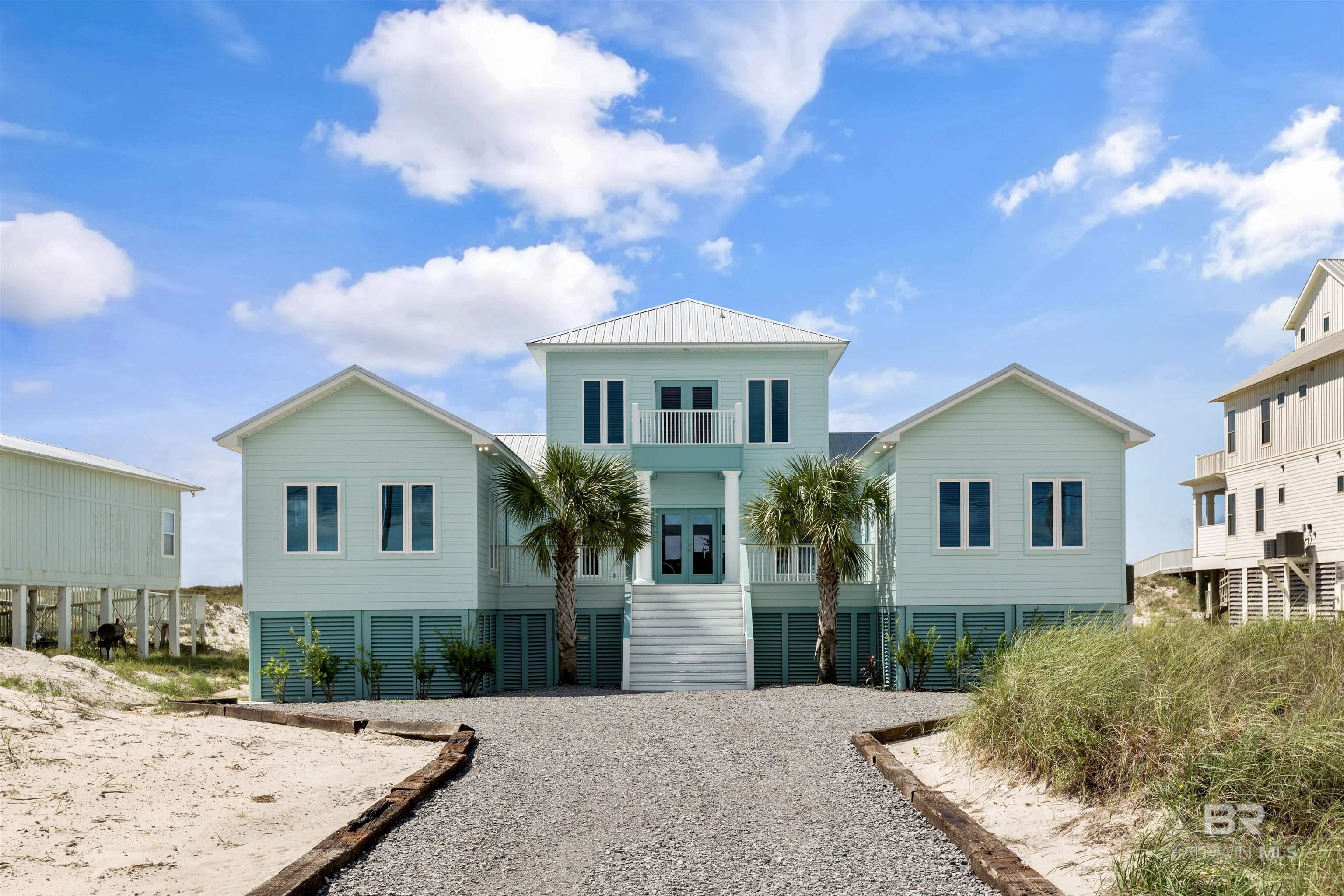 Gorgeous Gulf Front Home with new Upgrades and Renovations just completed!   This is an a large Income producer with projection of $140,000.00 yearly average.  CHECK OUT THE VIDEO TOUR TO SEE THE HOME!  This beautiful home has direct beach views of the Gulf of Mexico all across the back and lagoon views from the front.   The home sits on a large 100'x400' lot with 100' on the Gulf.  This home has been significantly renovated, rebuilt and professionally decorated with attention to every detail.   There is a new metal roof, new flooring, new kitchen counters, new gorgeous lighting, new appliances and new interior and exterior painting.   Your primary bedroom is large with a sitting area going out onto the porch overlooking the Beach, you have a very luxurious bathroom with an extra large step-in shower, glass surround and new beautiful countertops with unique LED lights above the double vanity.   The large back porch overlooks the Gulf of Mexico and is perfect for entertaining.  There is a also a side screened porch for relaxing having your coffee in the mornings and smaller gatherings.   There is also a large area of storage under the house.  Nice size sand dunes that help protect your home   The driveway has just been rebuilt to finish the exterior look.  This home is sold completely Furnished with all the furniture, furnishings, accessories and is rent ready to produce large rental income for an income investment or second home.