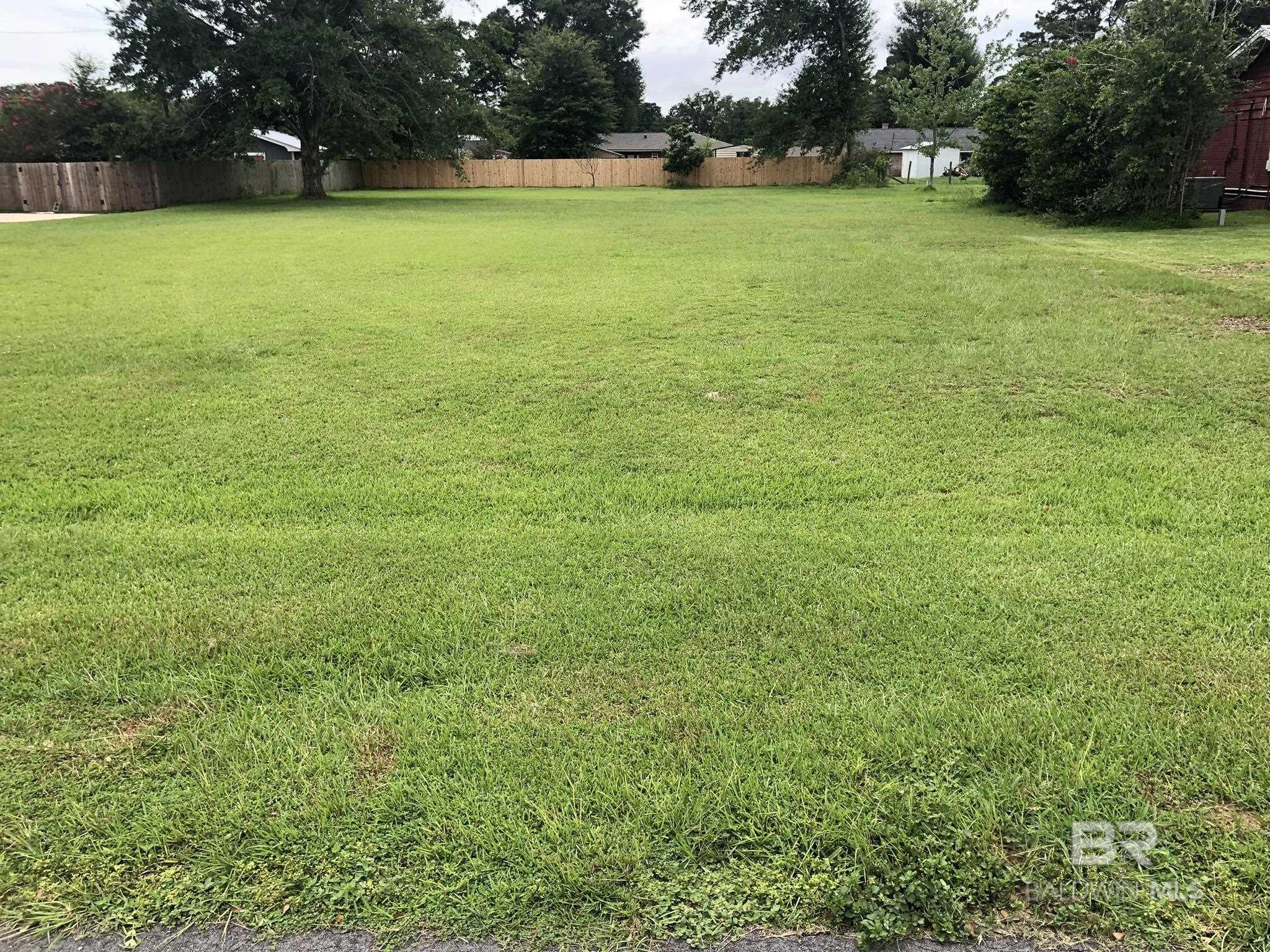 Boat lovers!!! This vacant lot in the Riverwood Subdivision nestled in Bon Secour is a great location to build your dream home. The lot is a nice level lot giving you the the best of both words, you can build on a high and dry with having access to your  deeded boat lot on Boggy Branch. Boggy Branch is a deep water creek that flows into the Bon Secour river with unobstructed access to Mobile bay and beyond.  The Riverwood Subdivision is made up of larger lots all roughly 100 X 200.  It is located off of county Road 10 on the South Side of Foley, making it convenient to the beaches and dining in Gulf Shores.  It is also convenient to shopping and dining in Foley, Fairhope and other delightful communities around Southern Baldwin County.  The Blessing of this community is you are able to choose between going to dinner by car or by boat.  If by Boat you can catch the great sunsets over Mobile Bay on your way either to or from dinner.  Come live the boat life!! Call now for your appointment.