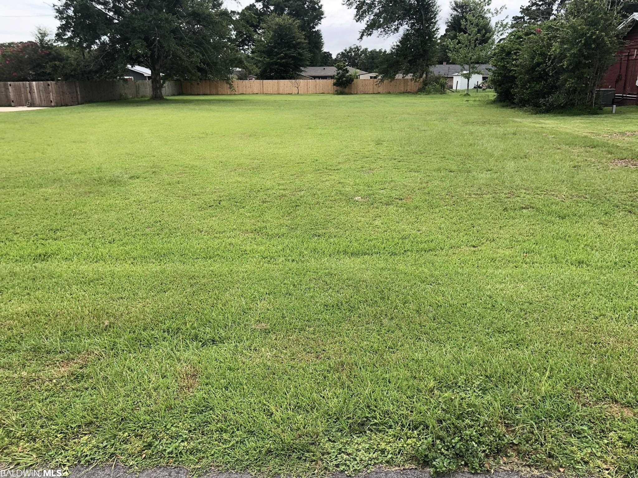 Boat lovers!!! This vacant lot in the Riverwood Subdivision nestled in Bon Secour is a great location to build your dream home. The lot is a nice level lot giving you the the best of both words, you can build on a high and dry with having access to your  deeded WATERFRONT boat lot on Boggy Branch. Boggy Branch is a deep water creek that flows into the Bon Secour river with unobstructed access to Mobile bay and beyond.The Riverwood Subdivision is made up of larger lots all roughly 100 X 200.  It is located off of county Road 10 on the South Side of Foley, making it convenient to the beaches and dining in Gulf Shores.  It is also convenient to shopping and dining in Foley, Fairhope and other delightful communities around Southern Baldwin County.The Blessing of this community is you are able to choose between going to dinner by car or by boat.  If by Boat you can catch the great sunsets over Mobile Bay on your way either to or from dinner.Come live the boat life!! Call now for your appointment.