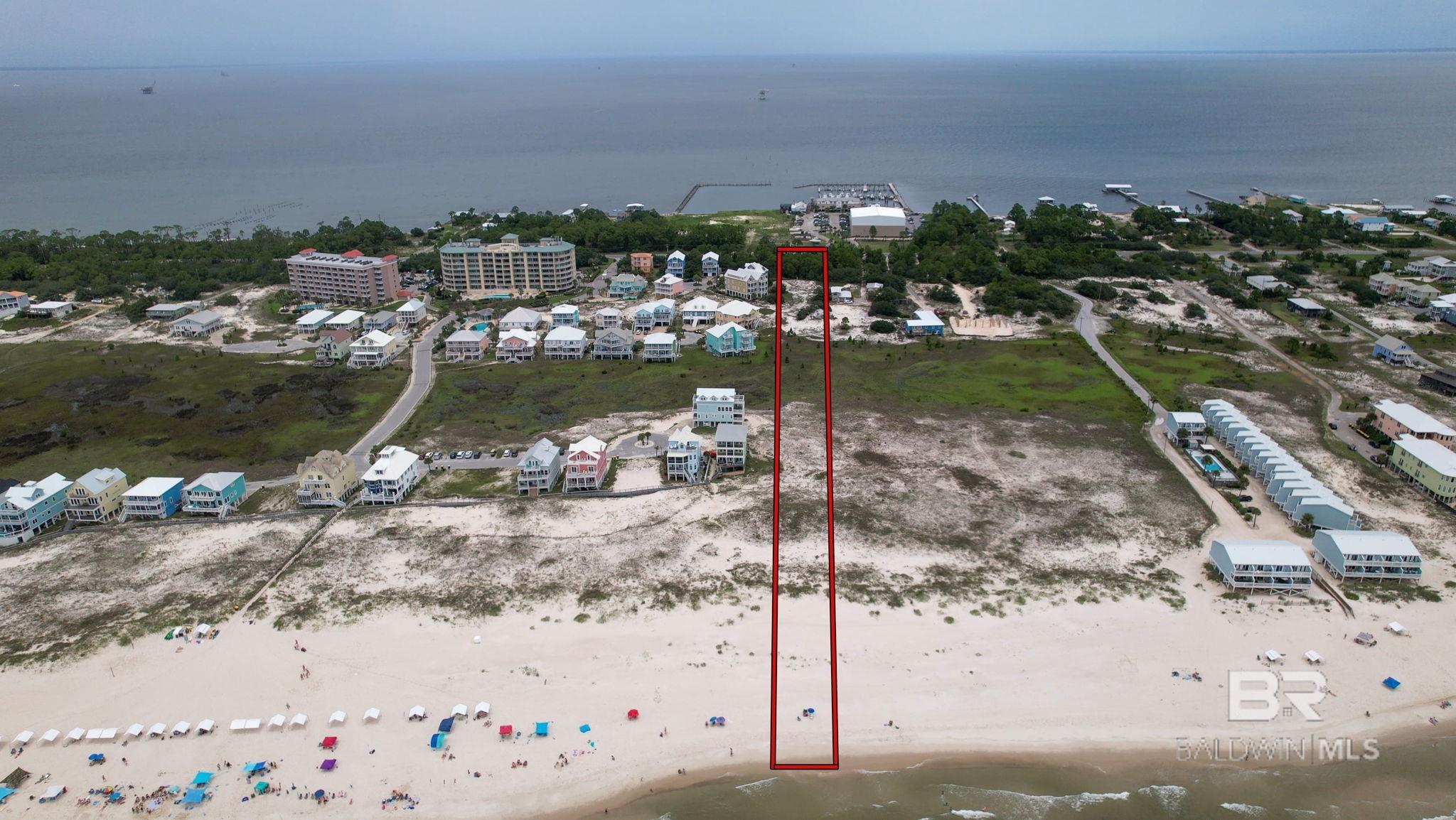 A must see! Open Gulf Front 3.4 acre lot, 100 x 1480. Convenient location across from the Fort Morgan Marina. Build your custom beach house or duplex. The marina offers many amenities. Take advantage of the nearby Gulf Coast Best Charter Fishing Fleet dry storage for boats up to 36’ in length, wet slips, dockside fuel, live or frozen bait, dock store, fish cleaning station, and fuel service. Don't forget the restaurants and private dolphin cruises. Everything you need to enjoy your new beach lifestyle!