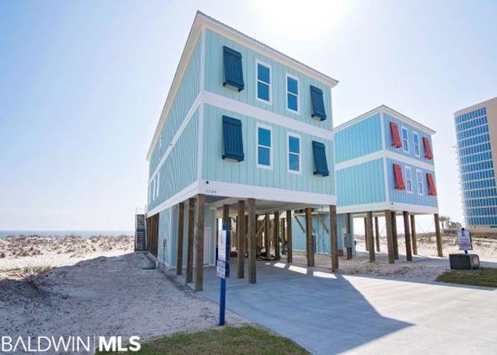 Welcome to "Orange Beach East" raised beach cottage! This 8bdrm/7.5bth home is a rare find in Orange Beach and offers a tremendous rental history, sleeping up to 32 guests! Built in 2017, this home is "Gold Fortified" offering all the latest amenities for its clients.... shiplap accent walls, SS appliances, 2 frigs, 2 dishwashers, 2 ranges, large dining table with seating to accommodate guests, LVP flooring, beautiful tiled bathrooms, bunk rooms for the kids, flat screen TVs, several guest suites offer private gulf front balconies, main living room is large, newly decorated and spacious for guests to spread out, 2nd level Living Area is perfect for the kids to have movie night, elevator, outdoor pool w/ heater, grilling area downstairs and so much more! This homes rental history was incredible 2022 and looking even better for 2023! Rental history is available upon request.