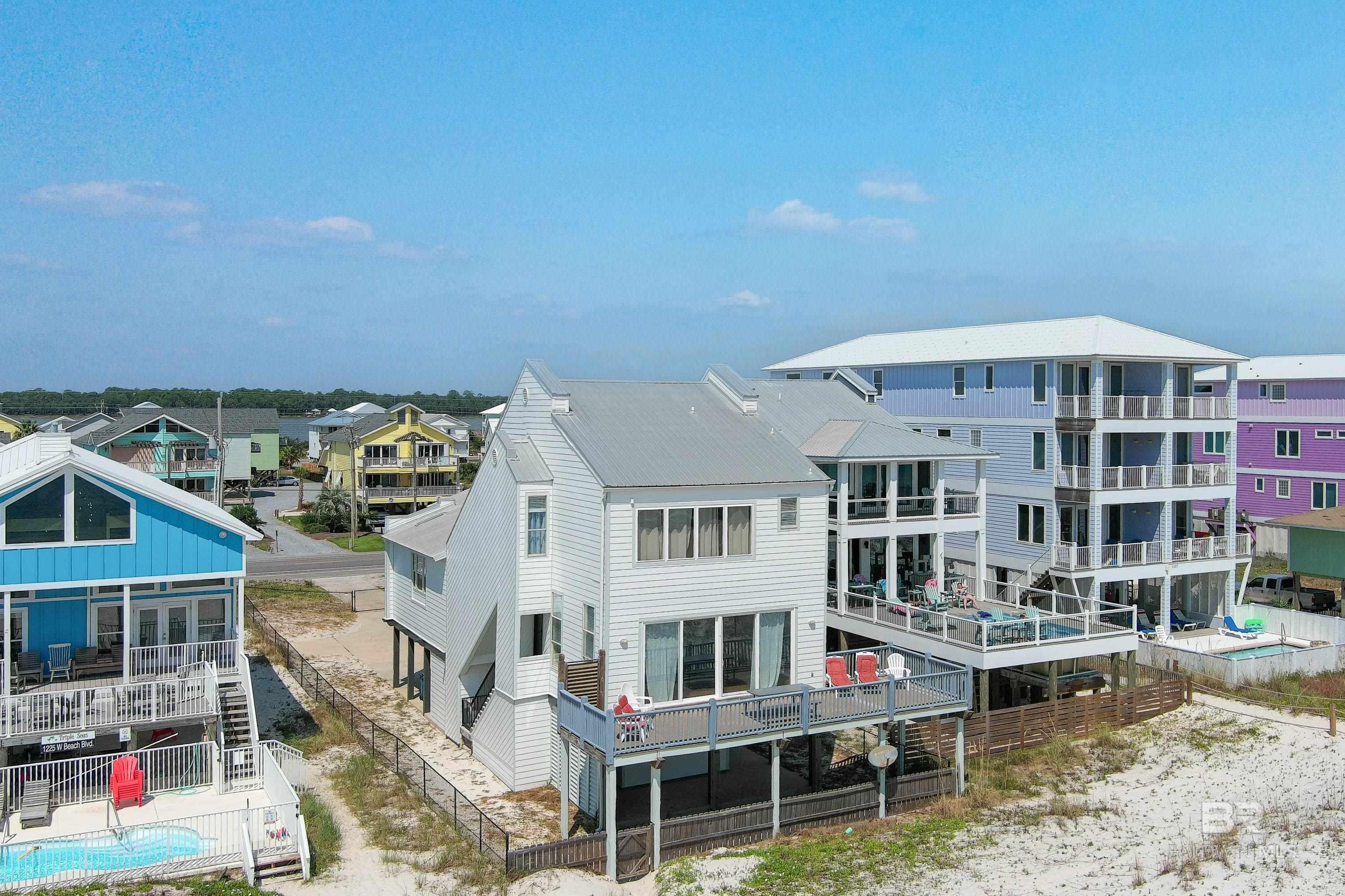 **For Sale: 1223 W Beach Blvd, Gulf Shores, AL - "Safari Shores"**  Step into a slice of paradise with this stunning 4-bedroom, 2.5-bathroom Gulf front home, perfectly situated on the pristine sandy white beaches of Gulf Shores, Alabama. Introducing "Safari Shores" - a rare gem in the heart of the Gulf Coast, offering breathtaking 46-foot-wide panoramic views of the azure waters and endless horizons.  Beyond its picturesque location, this property boasts an impressive rental history, making it not only an ideal family retreat but also a lucrative investment opportunity. Every detail of this home exudes charm and character, from its fireclay finishes to the thoughtfully designed interiors that capture the essence of coastal living.  One of the standout features of "Safari Shores" is its exclusive fenced and gated perimeter, ensuring utmost privacy and security for its residents. For those seeking an added layer of luxury, there's potential to install an automatic front entrance gate, elevating the property's allure.  Furthermore, the lot is zoned R-2, allowing for both single-family and duplex configurations, providing flexibility for future development or expansion with city zoning approval, of course. Its a GREAT location and close to the Hangout and Hangout Festival.   Don't miss out on this once-in-a-lifetime opportunity to own a piece of Gulf Shores' finest real estate. Whether you're looking to indulge in serene beachfront living or capitalize on its rental potential, "Safari Shores" promises to be a cherished asset for years to come.This home is fully stocked and furnished, turn key for your vacation rentals.   Contact us today to schedule a private tour and experience the magic of "Safari Shores" firsthand.