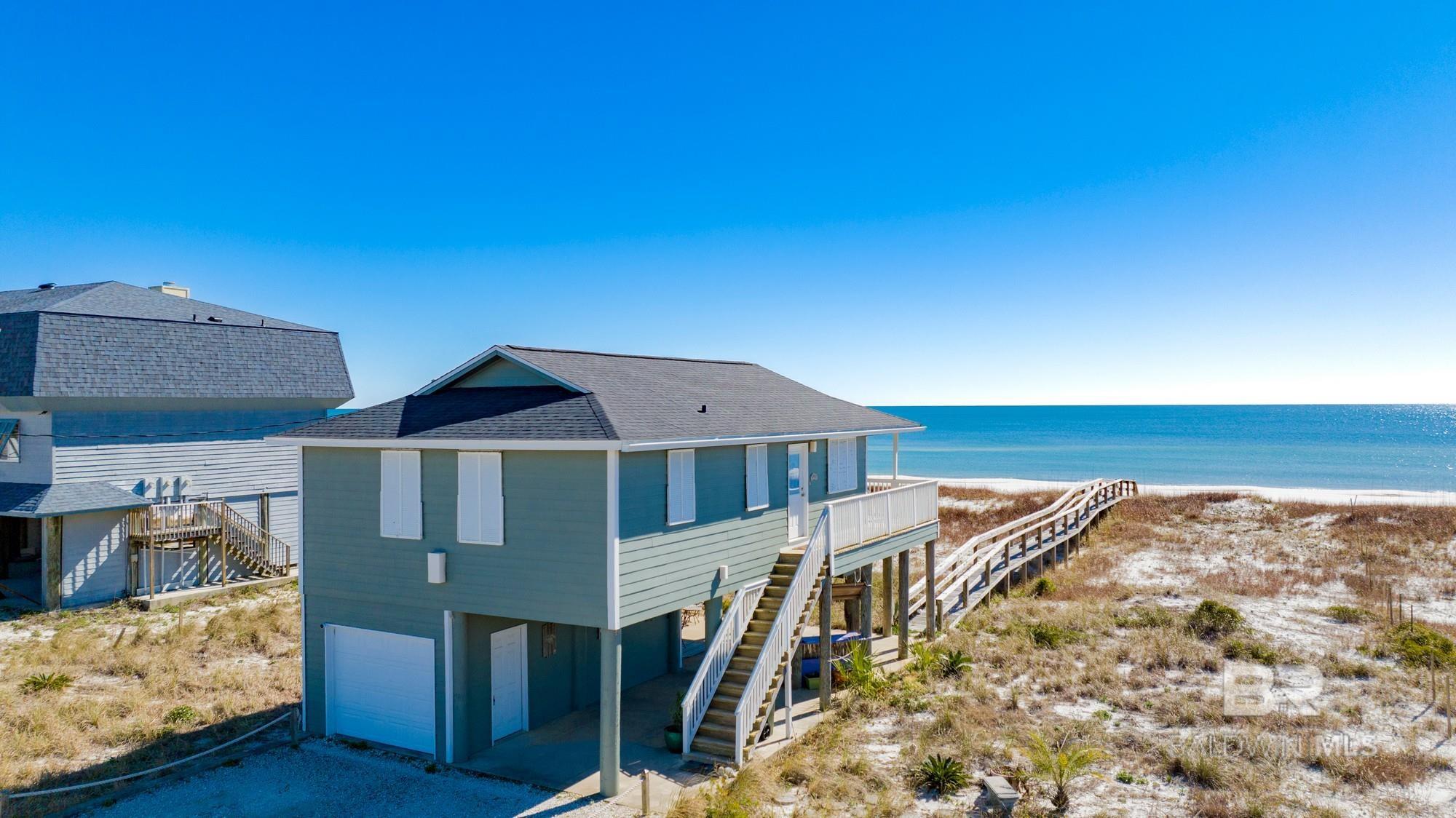 INVESTOR ALERT !  This 100 feet on the Gulf offers a rare opportunity to take advantage of its HIGH DENSITY ZONING TO DESIGN/BUILD UP TO 12 DIRECT GULF FRONT LUXURY RESIDENCES in an area of extreme low density. With almost no new properties currently being offered on Perdido Key, the demand potential goes without saying.  Built in 2008, the existing beach cottage is picture perfect and in excellent condition, able to act as a Sales & Development Center if desired, or simply enjoy as a low maintenance, high value "Retreat" for the family. With  a very limited number of properly zoned properties and even fewer permits being allocated, such opportunities are fast disappearing on Perdido Key. Even as a stand-alone property, this Gulf-front residence will provide excellent quality time for your family on an uncrowded Gulf beach and continue to grow in value over time.