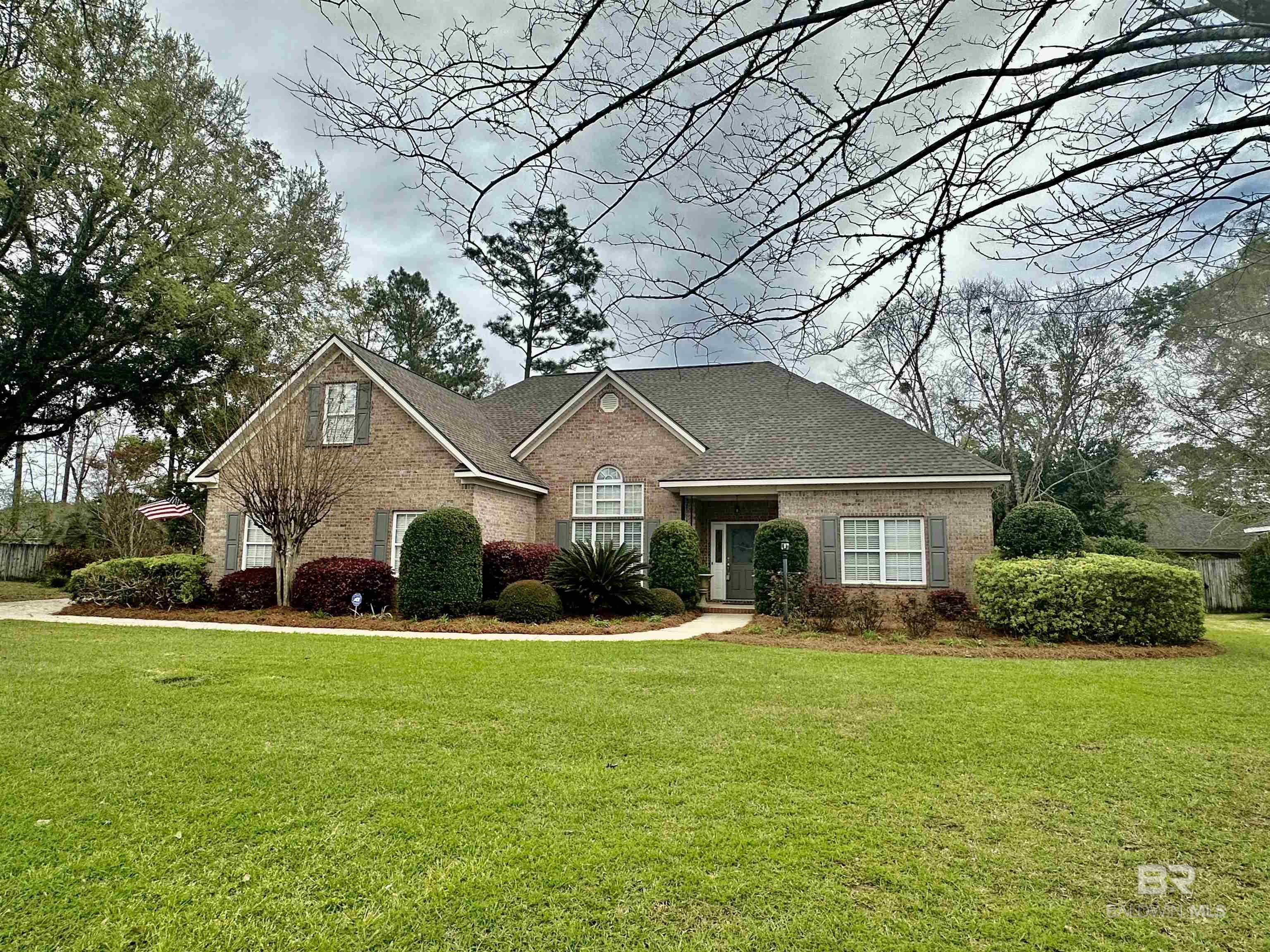Sehoy Beauty, Daphne Alabama! This custom brick home sits on a quiet cul-de-sac. It has Curb Appeal galore, Custom Landscaping, 2019 New roof, new paint, power-washed and is ready for YOU! It even has a Bonus surprise! The Formal Dining room opens to the Great room with high Vaulted ceilings & features a Corner Gas Fireplace. The large granite kitchen has abundant counters, cabinets with great storage, a separate pantry and breakfast bar. Kitchen overflows to Keeping Room/Breakfast Area with great natural lighting and window views. It is a split floorplan: total of 4 Bedrooms: 3 bedrooms are on Main Level, 1 bedroom is up. 3 bathrooms; 1 bath is up. The Master enSuite is located just off the breakfast room and is a world of its own. Features Trey Ceilings, Double Windows, Walk in Closets, Double Sinks, Separate Shower, Custom WALK-IN Jetted Tub, and Linen Closet. All bedrooms are carpeted. Now for the Bonus: a fabulous Slate Floored Sunroom that is over 180 extra sq feet & is included in sq. footage. It is heated and cooled by 2024 LG Window Unit System with Remote. Step outside to Entertaining Patios, a custom Pavillon for 2, Fenced Yard with lush landscaping. More features to appreciate are clean gutters, 2 car side-entry garage with extra storage space, sprinkler system, oversized driveway and much more. It is meticulously kept and waiting for you. Shown by Appt.