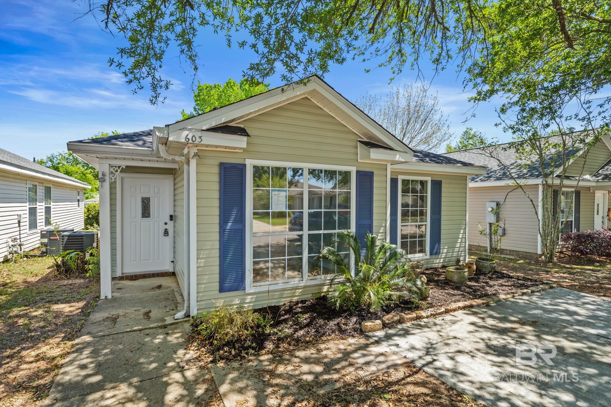 Small town charming streets, endless bay views, sprawling Live Oak canopies, and sunsets that seem to last a lifetime... Welcome to picturesque Fairhope, Alabama! This thoughtfully renovated home is situated only minutes from the famed downtown streets in the cottage community of Belle Chase. This like-new home features a brand new 2024 FORTIFIED roof which offers peace of mind and potential savings!!  Inside, new Luxury vinyl plank flooring flows seamlessly into the living room complete with vaulted ceilings and a fireplace.  In the front of the home, two bedrooms are situated off of the side hall, both share a common guest bath also located off of the hall. Back through the living area, a newly renovated kitchen with white cabinets, Quartz counters, and stainless appliances offer a beautiful space to prepare your fresh catch of the day or any culinary masterpiece of your choosing. A spacious dining nook is attached to the kitchen as well as a generously sized laundry room.   Off of the dining area, the Primary bedroom is located at the back of the home with an adjoining bathroom as well as an oversized closet.  Off of the kitchen, a screened porch leads out to a patio and a private back yard.  Unfortunately, only one lucky new Fairhopian can call this adorable cottage home, so time is of the essence!!  Call your favorite agent today to schedule a showing, and discover your new life in Fairhope, AL.  Buyer or buyer's agent to verify all pertinent information.