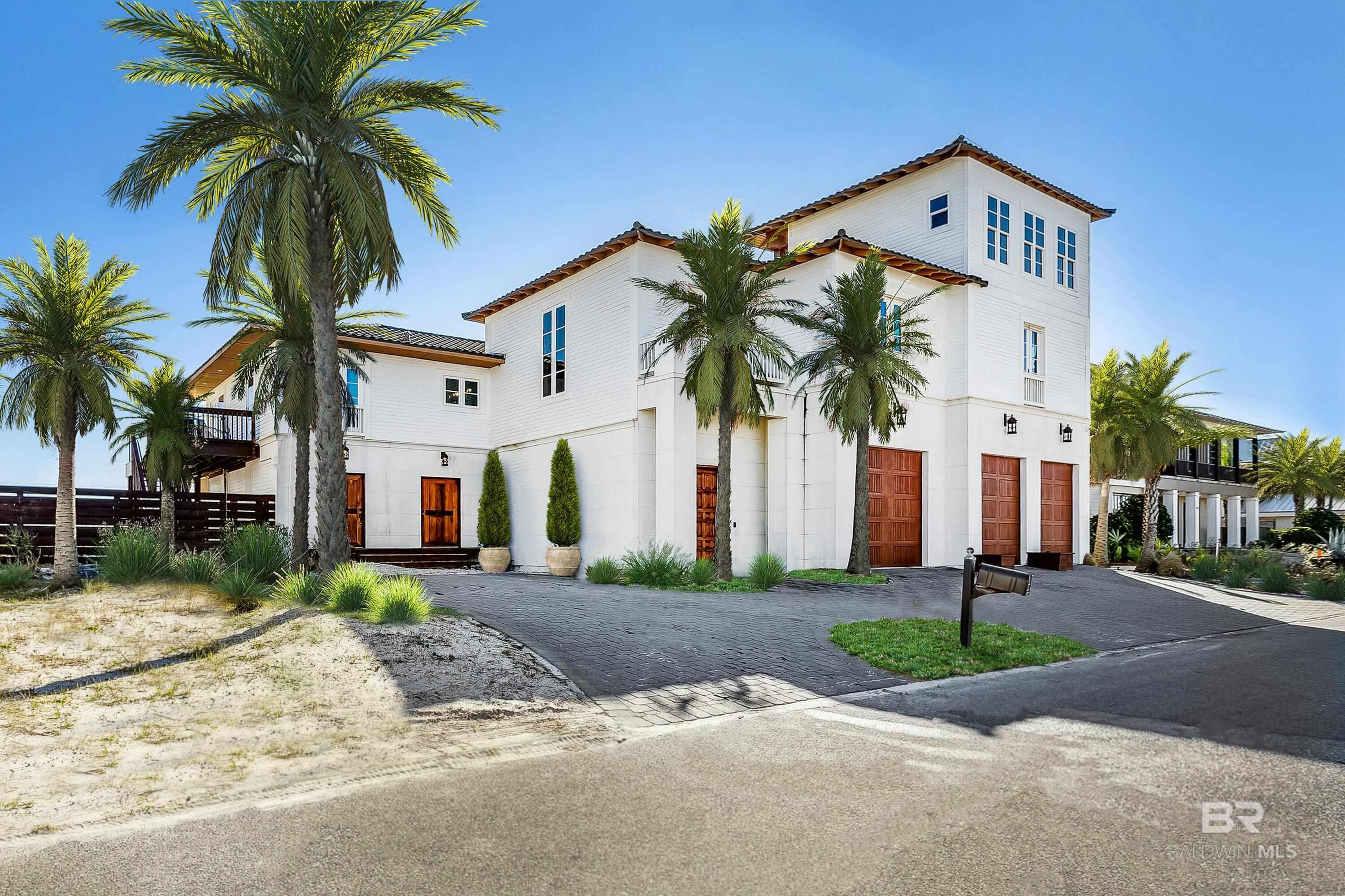 Welcome to luxury - 125’ of Gulf front living on Pensacola Beach, fully furnished 6-bedroom, 5-bath beach residence where memories are made strolling the shorelines, relaxing poolside by the infinity pool and marveling at the Blue Angels flying overhead. Meticulously rebuilt from the heartwood studs over two years & completed in 2020, this home seamlessly blends modern opulence with coastal charm. Indulge in panoramic Gulf views while basking in the heated infinity pool or luxuriating in the hot tub. The expansive open floor plan is tailor-made for both gracious living & effortless entertaining. A chef's dream, the kitchen boasts a sprawling marble-topped island accommodating six, complemented by a 48-inch gas cooktop where culinary magic unfolds. Distinguished by honed superlative marble countertops, the kitchen exudes both functionality & elegance, harmonizing with the monochromatic neutral palette of the living space, adorned with shiplap wood planks for a cozy coastal texture. The primary bedroom, thoughtfully positioned to overlook the Gulf & the infinity pool, invites serenity through sliding glass doors leading to the wrap-around porch. Pamper yourself in the primary ensuite bath featuring a spacious travertine-clad shower, double vanity, & a meticulously organized walk-in closet. A vast three-car garage with 10-foot-tall doors & ample storage space accommodates outdoor essentials, including oversized trucks or boats, with ease. Head to the pool "tower room," a haven of guest luxury boasting an ensuite bath & a Juliet balcony offering breathtaking views of both the heated infinity pool & the Gulf of Mexico, a spectacle especially captivating during Blue Angels displays. Added in 2020, this pool house with a separate entrance ensures privacy for guests. Completely turnkey – This home is ready for you to call the beach your home or utilize this amazing opportunity for an exceptional income producer. Buyer to verify all information during due diligence.