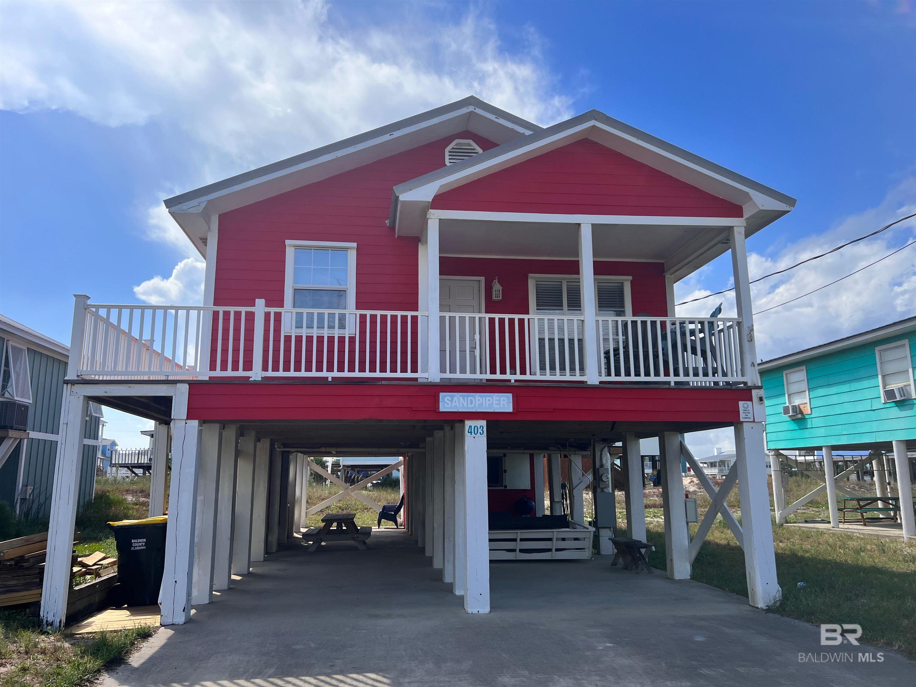 3BR/2BA Home located just a few steps from the beautiful Beach in Fort Morgan/Gulf Shores. This raised Beach Home is on a quiet street near the end of the Fort Morgan Peninsula with a public beach access just a few steps away! You'll enjoy Gulf views from the Front Porch and the private deck off the Master Bedroom. Storm Coverings for all windows. Sold Fully Furnished. Granite Countertops in the Kitchen with lots of seating for the family at Dinner time. Incredible Living Space underneath the home complete with a Daybed, a Couch and tons of extra seating and topped off with a Television and Sink and Outdoor Shower all under the home. Don't Miss out on this home! Buyer to verify all information during due diligence.