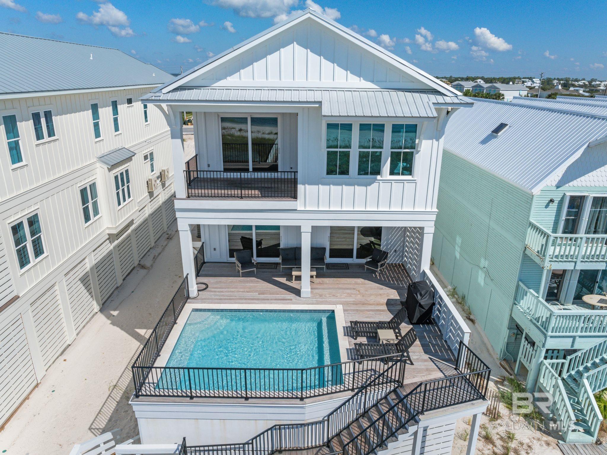 Welcome to Luna Azul! This 8BR/7.5BA luxury, Gulf-front home offers panoramic views of one of the prettiest beaches in the world! Listen to the waves and feel the breeze on the expansive top floor porch or lounge on the partially covered deck by your private saltwater, heated pool. When you're ready for a day at the beach, take a short stroll over on your private boardwalk. This 4600 sq ft gold fortified home was custom built by Greenleaf Construction. It features hardiboard exterior, metal roof, impact resistant windows, elevator, 10 foot ceilings, wet bar with wine cooler, quartz countertops, hardwood floors, custom cabinetry, and an additional 900 sq ft of porches and decks. Six of the bedrooms have en suite bathrooms for added privacy and convenience. The spacious and fully equipped kitchen is a chef's dream and is open to the living and dining areas for gathering and entertaining. Upstairs den area provides additional entertainment space. On the ground level, there is an additional 2900 sq ft of storage space, an outdoor shower, and covered parking for 5 vehicles. This home is being sold lavishly furnished and ready to enjoy as a primary residence, second home, or investment property. The home is currently being managed as a rental by Southern Resorts and future bookings must be honored. Buyer to verify all information during due diligence.