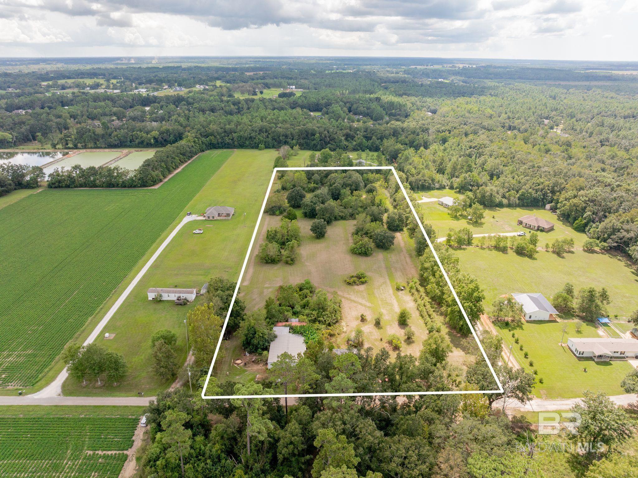 This is the property you have all been waiting for!! 7 acres of prime land with natural privacy, mature trees and beautiful grassy areas. This spacious property offers the tranquility of nature while still being close to everything you need. Come and create your own private retreat! Sitting on the front of the property, you will also find that this land also comes with a outdoor shop for all of your storage needs. Don't wait and miss this opportunity, schedule your showing today!! Buyer to verify all information during due diligence.