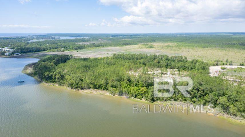 Over 60 Acres in the Gulf Shores City School District with over 3,500 feet of water frontage on Oyster Bay and the Intracoastal Waterway with direct access to Mobile Bay.   Includes PPin 63157, 63158, 24664 & 44621. Some Members of the selling entity are licensed Real Estate Brokers in the State of Alabama and Owners/Broker of RE/MAX Paradise Buyer to verify all information during due diligence.