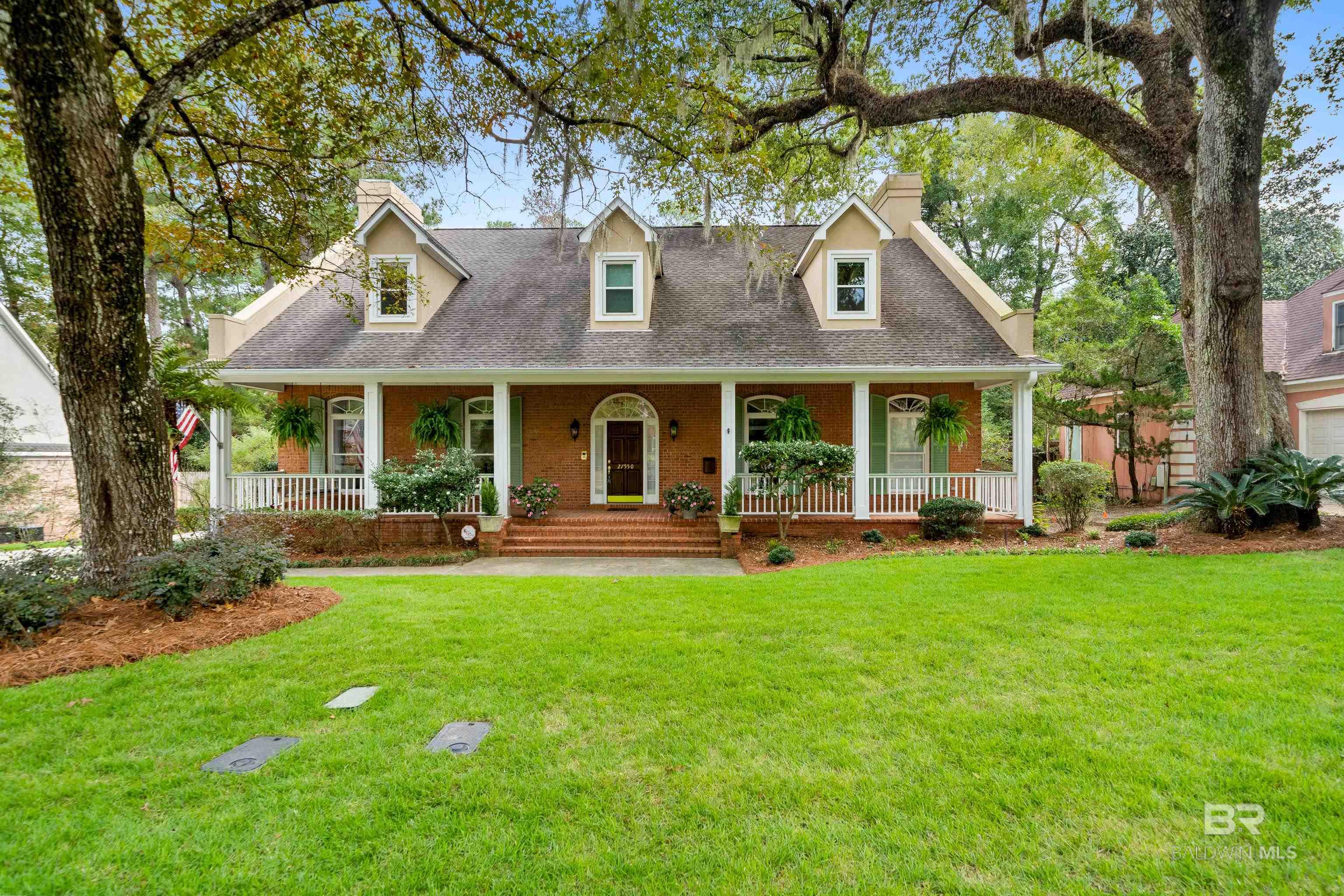 Gorgeous custom home with magnificent oak trees framing this property in one of Daphne's best neighborhoods.  The classic brick Creole Cottage design is well maintained, with a functional floor plan.  The home has tall ceilings with beautiful finishes and crown molding. The home has an appealing front porch complete with a porch swing ! Inside is a foyer, a separate dining room, a large kitchen with breakfast room, an office on main floor (could be modified for a 4th  bedroom). The large great room with a fireplace overlooks the gorgeous covered back porch and landscaped fenced backyard with several satsuma trees!  Large Primary bedroom with an impressive bath with double vanity, his and her oversized closets, separate shower and whirlpool tub. Upstairs are 2 large bedrooms with en-suite bathrooms, and incredible storage. Beautifully landscaped on a quiet cul-de-sac. The Harbor Place neighborhood has deeded bay access for homeowners only, accessed through a locked gate and extensive raised boardwalks with private beach and pier, adjoins the 60 acre Village Point Park Preserve. Conveniently located to shopping, schools and only 2 miles to I-10. Buyer to verify all information during due diligence.