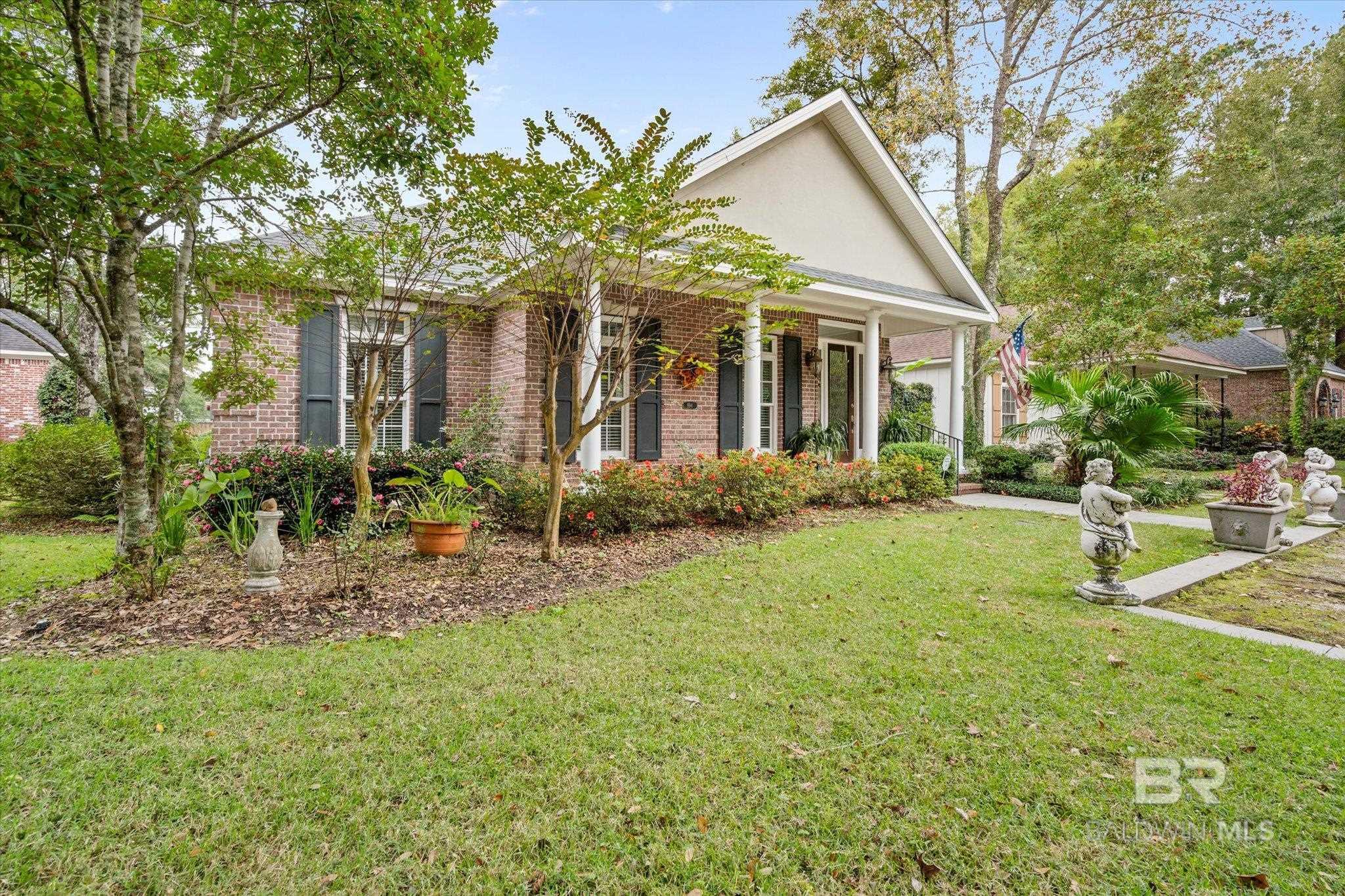 Fabulous location in Old Daphne. Beautiful Brick Home backs up to Lott Tennis & Pickleball Park.  Plantation Shutters throughout, 10 ft. Ceilings, Crown molding, Gorgeous Pine Floors, Gas Log Fireplace, Bookcases.  Eat in Kitchen has lots of cabinets, 5 burner gas range, New Granite Countertops, Beautiful Subway Tile Backsplash.  Master Bath has two 12x9 closets, jetter tub, separate shower.  Large storage closets in hallway.  Wonderful fenced side courtyard has stamped concrete, Gazebo, great for outside entertaining.  Alley runs behind home (Garage entry) NEW ROOF OCT 2024.  A MUST TO SEE!!!  *(ANY/ALL UPDATES ARE PER SELLER).LISTING BROKER MAKES NO REPRESENTATION TO SQUARE FOOTAGE ACCURACY. BUYER TO VERIFY.  Buyer to verify all information during due diligence.