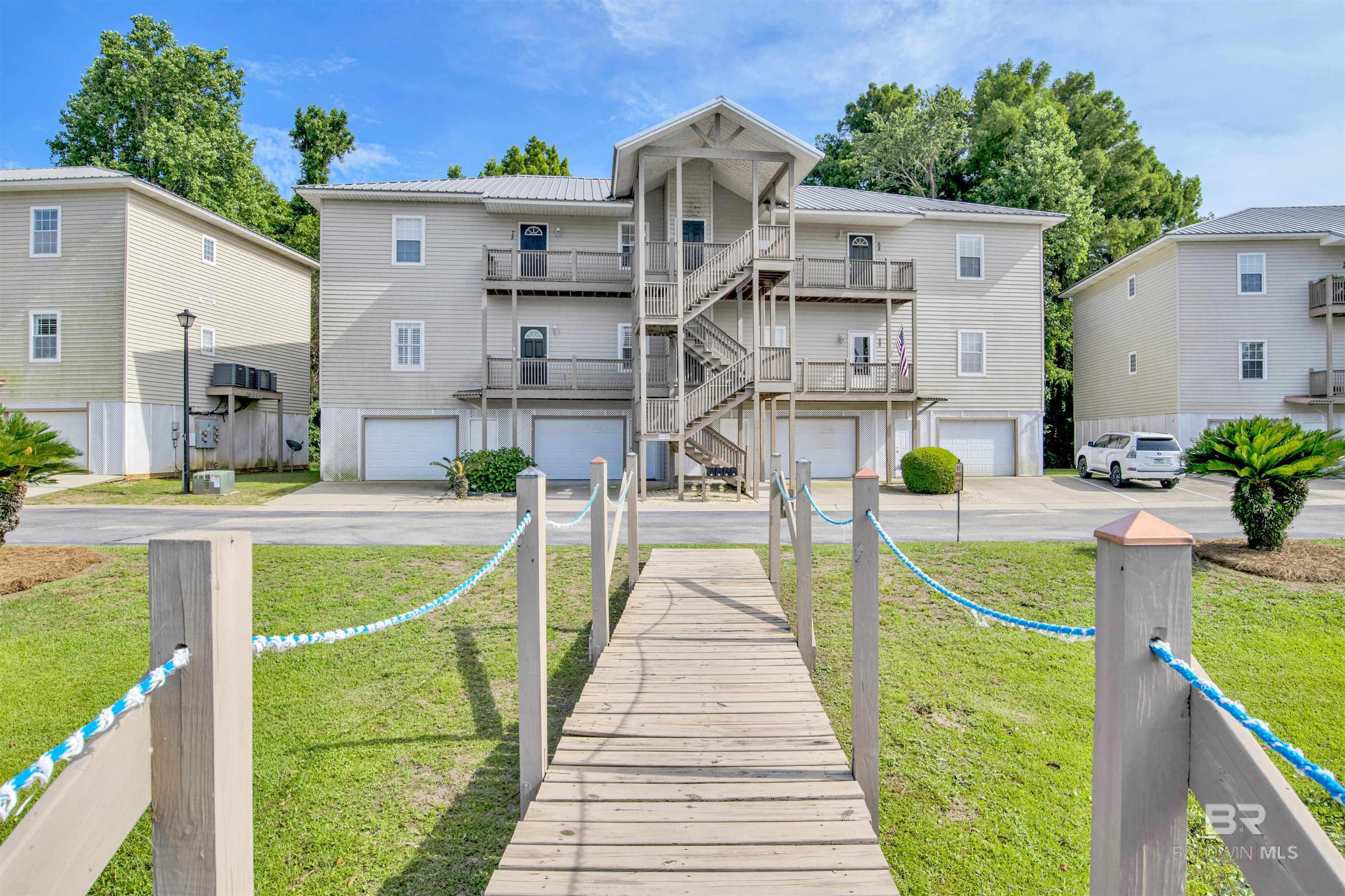 This newly remodeled 3-bedroom, 3-bathroom condo offers access to Mobile Bay and stunning sunsets. Inside, you'll find an airy layout with hardwood floors, plantation shutters, high ceilings, and elegant crown molding. The kitchen boasts GE stainless steel appliances, a custom backsplash, and beautiful fantasy brown granite countertops. The spacious primary suite features a jetted tub, walk-in shower, and a sizable walk-in closet. Plus, there's an oversized garage for three vehicles and a convenient building elevator. Enjoy resort-style amenities including a pool, hot tub, BBQ pavilion, stocked fishing pond, and private fishing pier. Just steps away, you'll find a boat launch and The Waterfront restaurant. Can be purchased furnished for $280,000. Buyer to verify all information during due diligence.