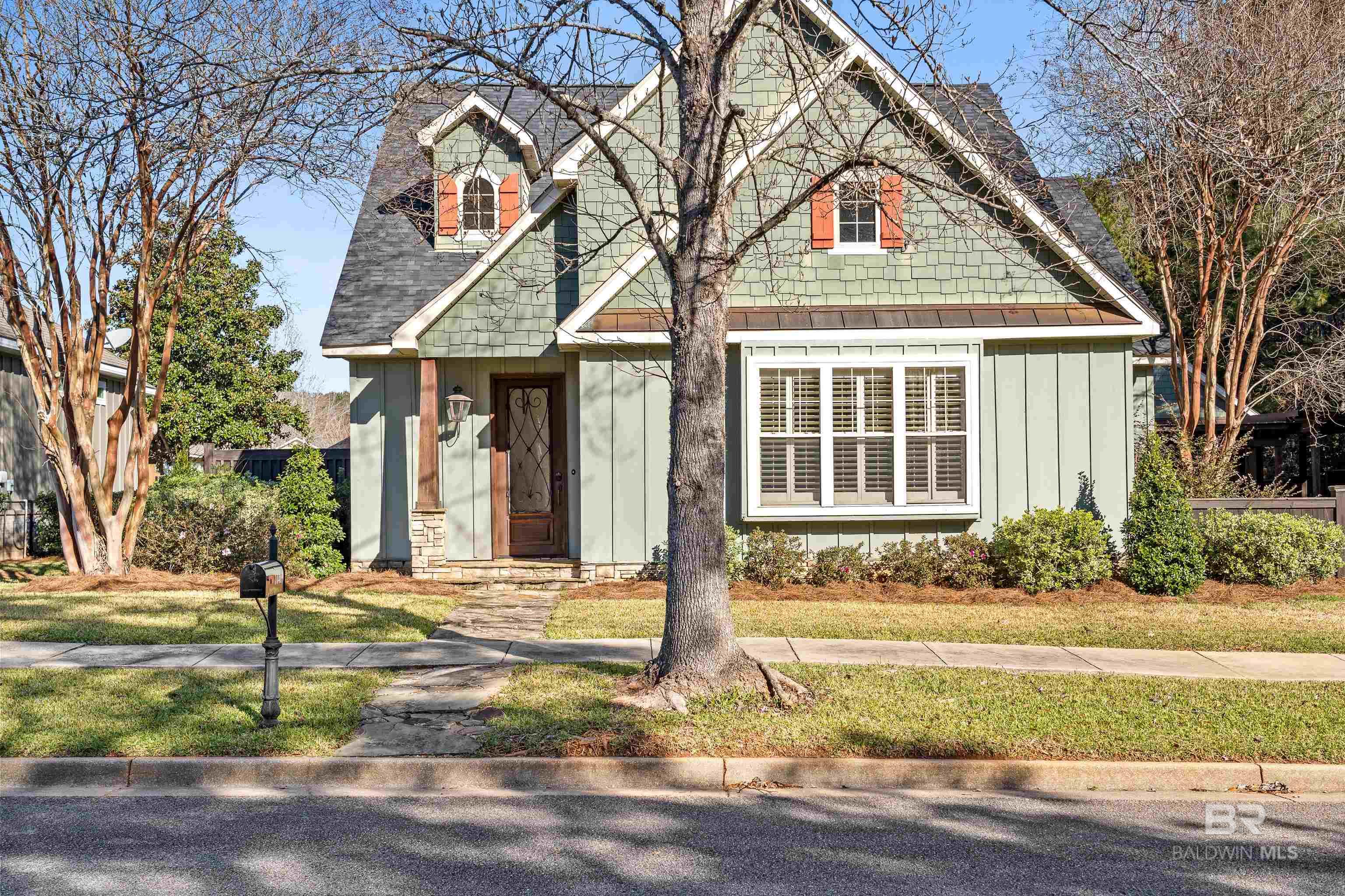 **SHAKE YOUR PALM PALMS!** Your sun-soaked Southern dream is waiting at the *end of a peaceful cul-de-sac* in the heart of **Historic Malbis** — and it’s ready to WOW you.**LOCATION, LOCATION, POOLcation!** This **charming craftsman-style cottage** features **fresh paint, brand new carpet**, and a vibe that screams *sip-something-sparkly-on-the-porch-swing* while the kids cannonball into the **saltwater pool**. Talk about resort-style living—without the resort fees.2023 **FORTIFIED ROOF** means you’re covered (literally). The lush **wooded backyard view**? That’s your private jungle oasis. Got friends coming over? Fire up the grill under the **pergola**, and let the good times roll. Need a break from the party? Kick back on the **porch swing** and pretend you're in a sweet tea commercial. Inside, the **double-sided gas fireplace** keeps the vibes cozy from both the living room and the kitchen/dining combo. The **oversized primary suite upstairs** is your grown-up getaway, while the 2 downstairs bedrooms are perfect for kiddos or guests.BONUS ROUND: The **garage apartment** is a total game changer—whether you need a guest suite, home office or art studio.  And yep, there’s a **pool bath** in the garage too. How convenient! In this **golf cart-friendly neighborhood**, you’re just a cruise away from lattes, local eats, cocktail spots, and shopping galore. Beach day? You’re minutes from the white sands of the Gulf Coast. Quick Mobile commute? You bet.This isn’t just a house—it’s a whole *mood*. Don’t miss your shot to live in one of the **most desirable neighborhoods** on the Alabama Gulf Coast.**Call your favorite agent now to tour this slice of sunshine!**   Buyer to verify all information during due diligence.