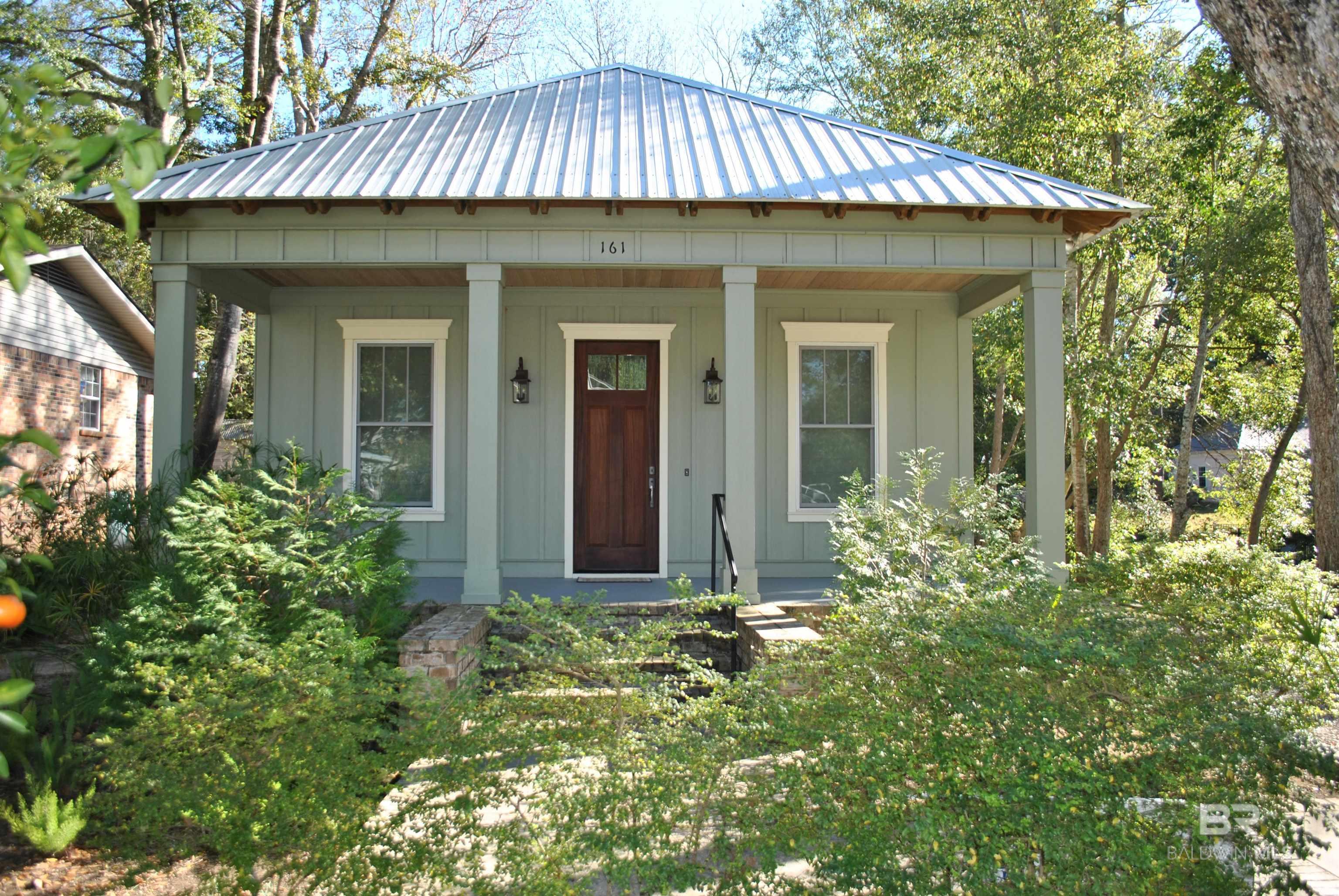 If you are looking for a Custom built home closer to downtown than the Fruit & Nut district look no further. This Gold-fortified home built by Rob Littleton is looking for its next owner. When puling in the driveway you will notice the Custom Rafter Tails and Solid Mahogany front door. Upon entering you feel the openness of the living space with Vaulted ceiling  and open Kitchen. All appliances and washer and dryer to convey with sale. The large screen porch is perfect for lounging in the peaceful surrounding of the back yard with outdoor patio. The separate garage has lots of space with attic storage. If you are looking for a downtown home with a 60 second golf cart ride to all Fairhope has to offer don't pass this one up. Buyer to verify all information during due diligence.