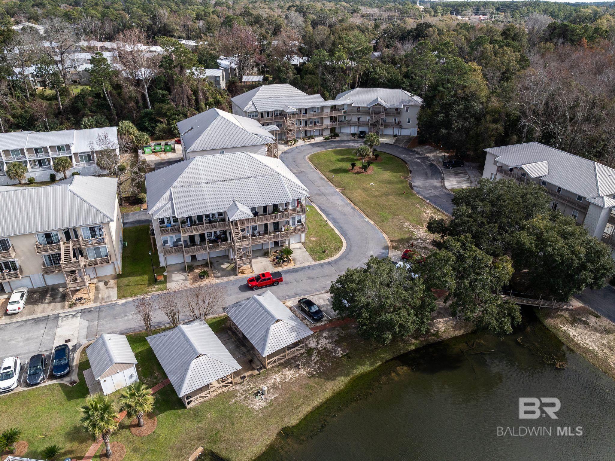 NEW PRICE $169,900! New $4,000 HVAC 2025 -Stunning 2-Bedroom Condo with Breathtaking, Mobile Bay Views! Welcome to your dream retreat on the tranquil shores of Mobile Bay in beautiful Daphne! This meticulously maintained, fully furnished condo offers the perfect blend of modern comfort and coastal charm, making it an ideal getaway or a permanent residence.  Wake up to stunning sunrises and unwind with picturesque sunsets and the serenity of bay life. Step inside to discover a beautifully designed space featuring modern furnishings that create a warm and inviting atmosphere. The open-concept living area is perfect for entertaining, while the well-appointed kitchen boasts contemporary appliances and ample counter space. Dive into relaxation with access to the community pool, or take a leisurely stroll around the tranquil pond. Enjoy direct access to the pier, where you can fish, kayak, or simply soak up the sun. Convenience is at your fingertips! This condo is ideally situated close to I-10, offering easy access to shopping, dining, and top-rated schools. Enjoy the best of both worlds with a peaceful bay front lifestyle and proximity to urban amenities. Whether you’re looking for a weekend getaway, a rental investment, or a place to call home, this condo is the perfect choice. With an unbeatable location and exceptional features, this condo will not last long. Schedule a private showing today and take the first step towards owning your slice of paradise on Mobile Bay, your coastal oasis awaits! Buyer to verify all information during due diligence.