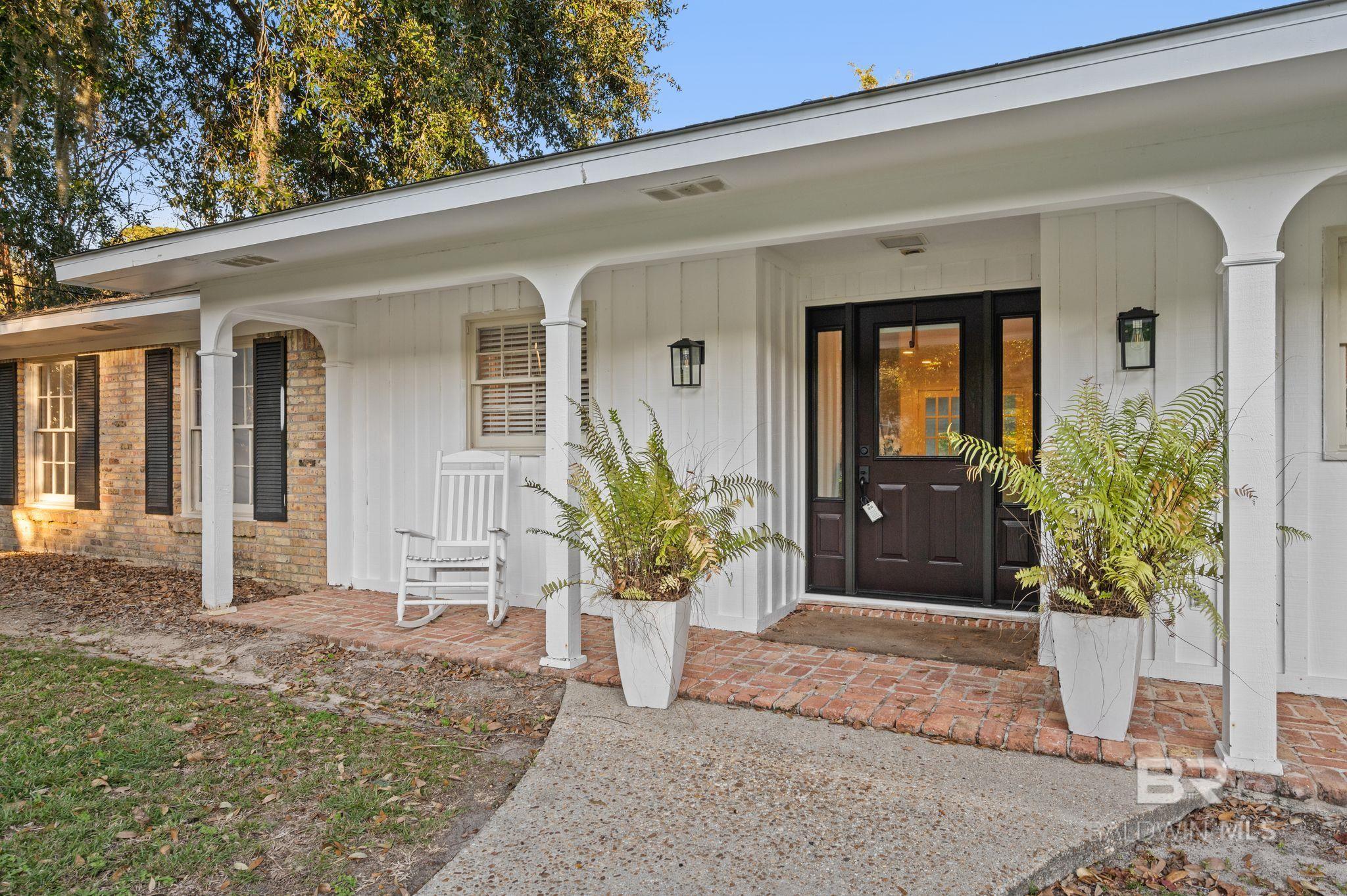 VRM Price $690,000-$730,000 along the scenic, tree-lined streets of Old Daphne, 1104 Captain O'Neal Drive offers a rare opportunity to experience the charm and serenity of one of the most sought-after neighborhoods in Baldwin County. This beautiful residence, situated on a quiet, established street, captures the essence of Southern living at its finest, with majestic oak trees draped in Spanish moss framing the area and providing a timeless sense of tranquility.Stepping inside, you'll immediately notice the inviting, open-concept floor plan that seamlessly blends traditional design elements with modern updates. Large windows throughout the home bring the natural beauty of the surrounding landscape indoors, offering views of the lush greenery and mature trees that surround the property. A spacious living room with hardwood floors and a cozy fireplace provides a space for both family gatherings and quiet evenings at home.The heart of the home is the fully equipped kitchen, featuring modern appliances, custom cabinetry, and an expansive island used for meal prep or casual dining. Adjacent to the kitchen is a breakfast area, used for entertaining guests or enjoying family meals in style. Whether you're hosting a dinner party or simply relaxing after a long day, the flow of the space ensures a comfortable and inviting atmosphere.The master suite is a true retreat, offering a peaceful haven with serene views of the backyard and beyond. Two additional bedrooms, each thoughtfully appointed with ample closet space and large windows, provide flexibility for family, guests, or a home office.Outside, the spacious patio area is perfect for outdoor dining and entertaining. Information provided is deemed reliable, but not guaranteed. Buyer or Buyer's Agent to verify all pertinent information. Buyer to verify all info Buyer Buyer to verify all information Buyer to verify all information during due diligence.
