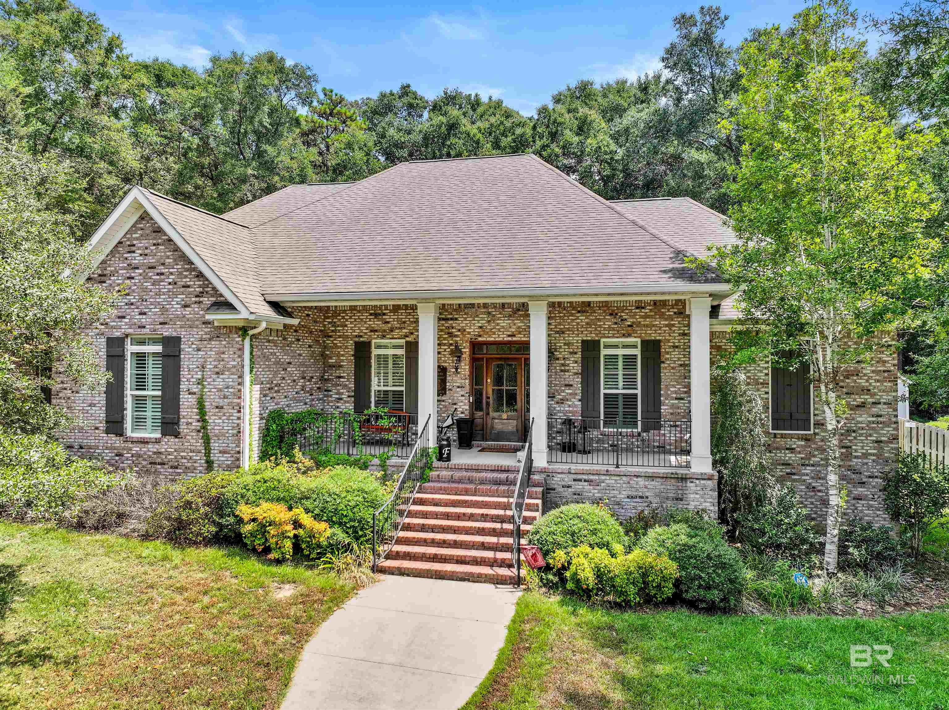 VA Loan Assumption Opportunity at 4.625%! Veterans, seize this incredible opportunity! The sellers of this stunning custom home in Daphne's Oak Creek Subdivision are offering to let a qualified veteran assume their existing VA loan at a remarkably low rate of just 4.625%! Call for details and eligibility requirements. This meticulously maintained 4-bedroom, 3-bathroom residence showcases the hallmarks of custom construction, including crown molding throughout and other fine features that elevate its appeal. It offers luxurious living and entertaining spaces. The open kitchen features granite countertops, stainless steel appliances (including a gas Thermador range), and a spacious walk-in pantry. The sellers also converted the living room fireplace to gas just two years ago, adding to the ambiance and convenience of this inviting space. The primary suite is a true retreat, easily accommodating a king-size bed and boasting a spa-like en suite bathroom with a separate shower and soaking tub, plus an enormous custom walk-in closet. Each guest bedroom also includes a walk-in closet. Custom shutters grace all bedrooms and the dining room, adding a touch of elegance. Enjoy nearly endless hot water with two tankless Noritz water heaters. A large 3-car garage, an expansive walk-up attic, and Generac whole-home generator provide added value and peace of mind. Step into the newly completed sunroom for year-round enjoyment. The home's common areas are pre-wired for surround sound for added entertainment value! Lastly, the sellers installed a brand new grinder pump in 2024. This exceptional property is a must-see! Buyer to verify all information during due diligence.