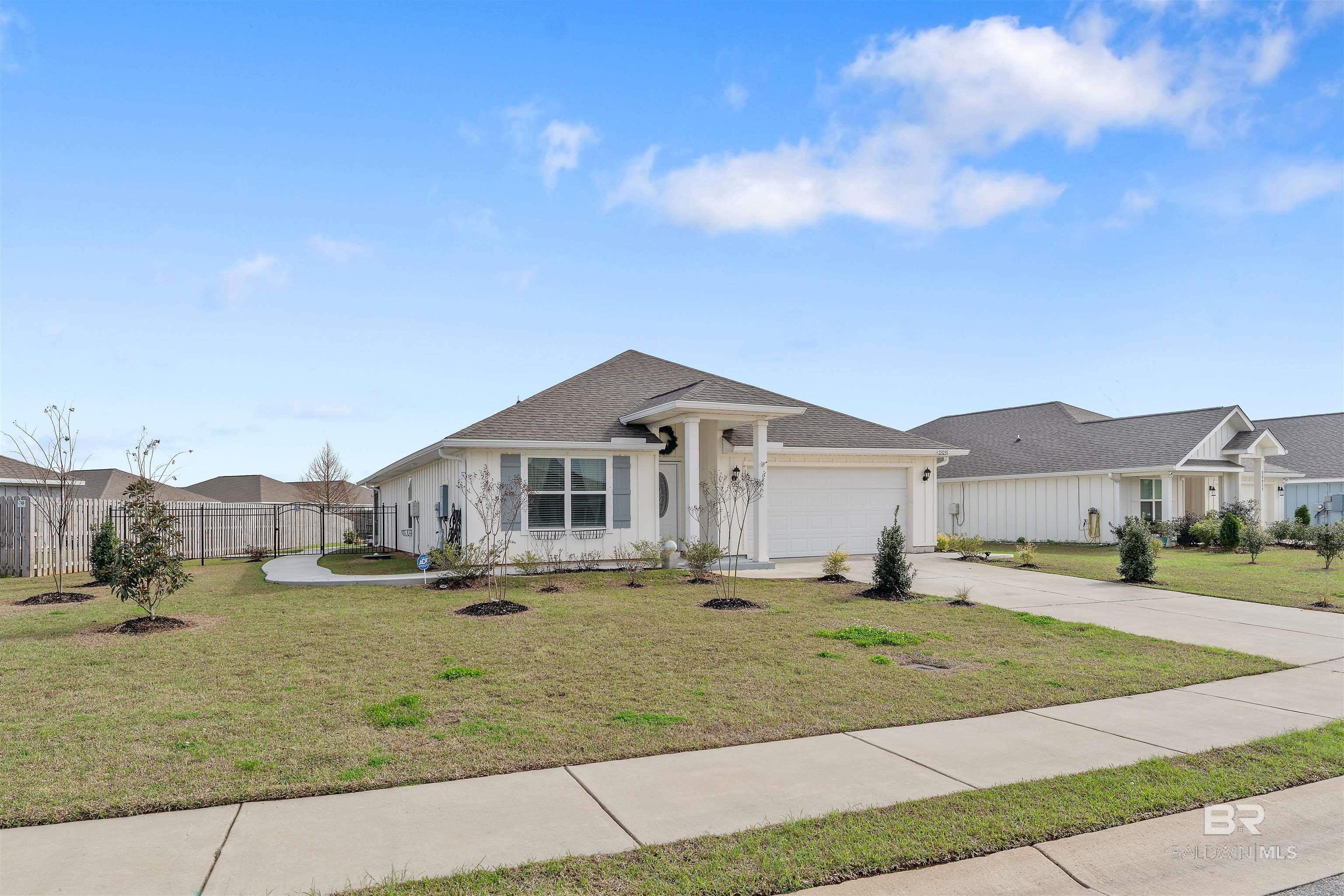 This charming and RENOVATED Gold Fortified home that backs up to a community pond is for sale! Both bathrooms have been tastefully remodeled. Beautiful new hardwood flooring runs throughout the home, excluding the bedrooms. With the home's Gold Fortification, new owners may save up to 50% on their annual homeowners insurance and be better protected againststorms. Custom backsplash was installed in the kitchen. New gutters have been added as well. A newly poured concrete path runs through the fenced and well-kept backyard. Future owners will enjoy calm evenings on the screened-in back porch. High-end tile was installed on the back porch. Custom shelves have been added in the primary closet. The laundry room has been updated with quality tile and cabinets. New high-end carpet has been installed in the bedrooms. Finally, you'll find new ceiling fans and a new front door. Pride of ownership is evident in this move-in ready home! This community is located close to all things Fairhope, Daphne and Spanish Fort with easy access to the beach. Buyer to verify all information during due diligence.