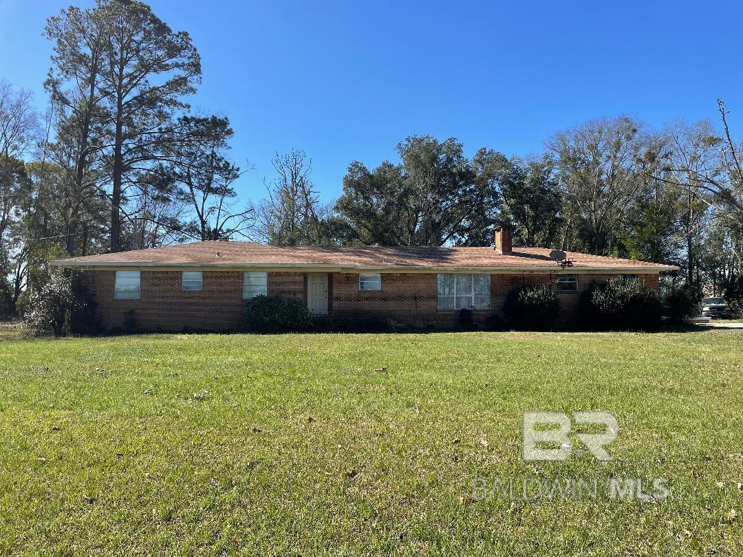 Don't miss your opportunity to own this beautiful 12+ acre piece of property in the desirable Belforest community. The 3 bedroom 2 bath brick home has lovely hardwood floors throughout and large windows to soak up the scenery. The open concept kitchen has a center island overlooking the brick fireplace of the family room. A sizable dining/living room combo opens up to the private back porch surrounded by mature trees. Home has a new roof from 2021 and additional outdoor storage space off the carport. With all of the peace and tranquility of country living yet convenient to shopping and restaurants - this is the perfect place to call home.  Buyer to verify all information during due diligence.