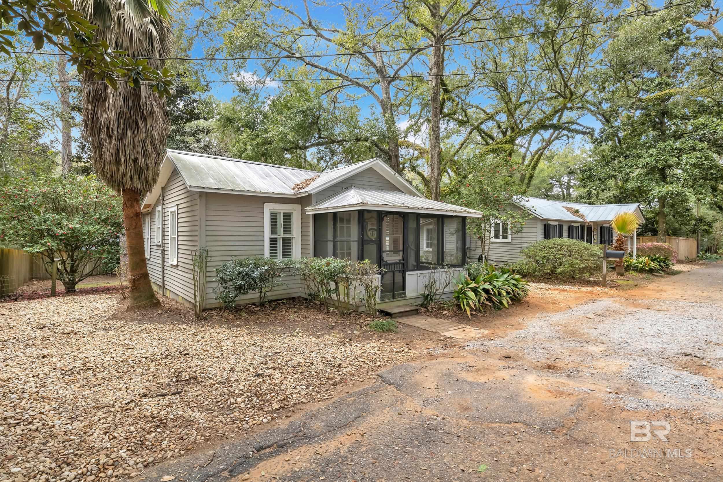 A VERY UNIQUE OPPORTUNITY! - TWO HOMES ON A SINGLE PARCEL OF LAND! 55 Boise Lane and 57 Boise Lane are located in The Bluffs of Fairhope, a neighborhood greatly desired for its stunning views, tree-lined streets and close proximity to vibrant downtown Fairhope. Nestled on a quaint, quiet Lane, these two historic cottages, built in 1905, offer endless possibilities. MLS Input form reflects data from 55 Boise Lane. Tax records identify parcel as 55 Boise Lane. Homes have 2 distinctive mailing addresses: 55 Boise Lane and 57 Boise Lane. Both have separate utilities. Both have 2 bedrooms and 1 full bathroom. Both have hardwood floors. Both homes have metal roofs and designated parking spaces. While these cottages have been lovingly maintained over the years, they do require some TLC to restore them to their full potential. Investors and homeowners with a passion for restoration will appreciate the chance to breathe new life into these charming structures thereby increasing their long-term value. Whether you are an investor seeking a lucrative addition to your portfolio, an individual looking for a multi-family arrangement or a restoration enthusiast eager to bring history back to life, do not overlook this is a rare opportunity to own a piece of history and create a vision for the future. 57 Boise Lane square footage: 599. This property adjoins 56 N Bayview Street (MLS #373923). Seller willing to negotiate if Buyer is interested in both parcels. Buyer to verify all information during due diligence.