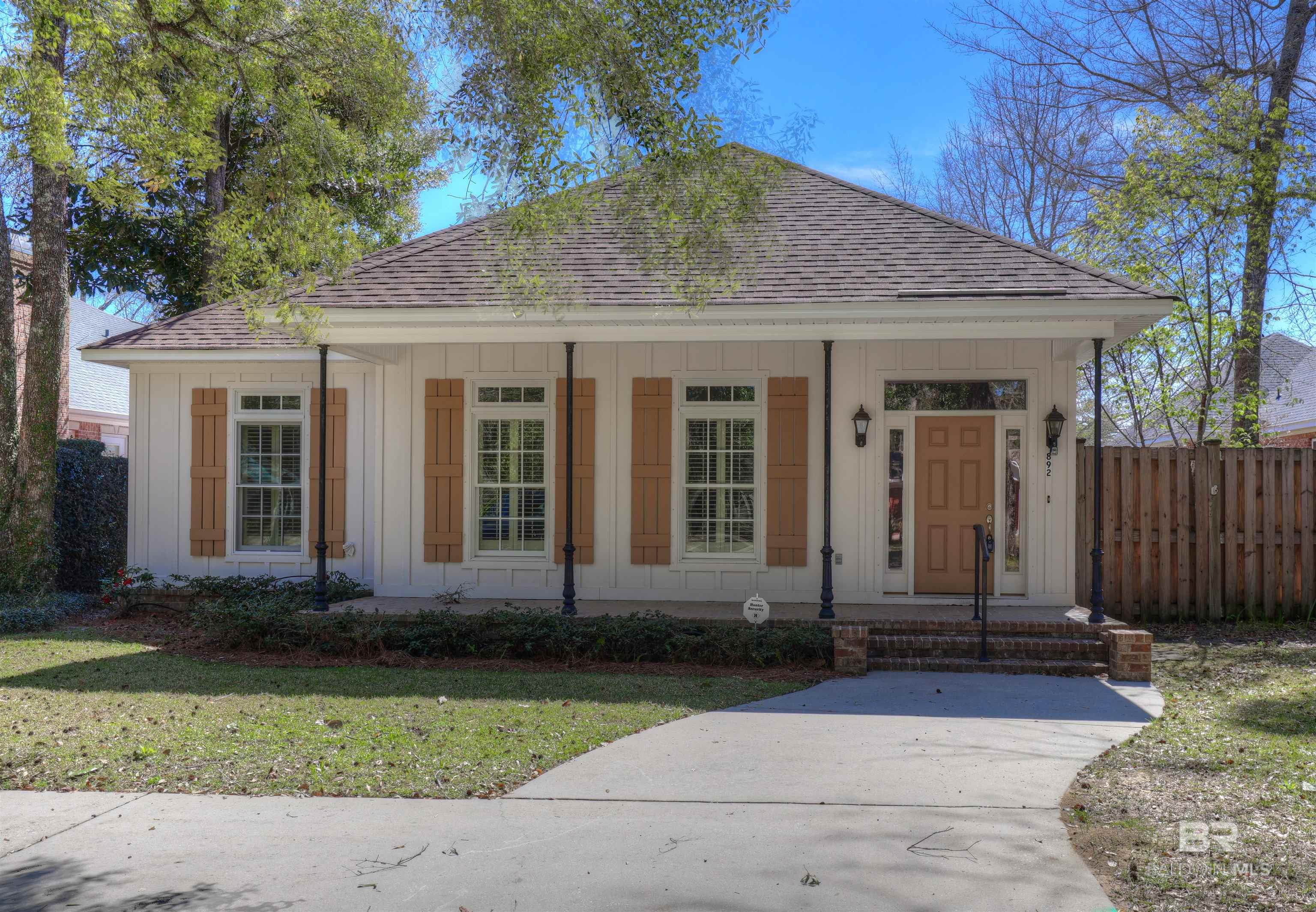Custom-built gem in Old Town Daphne!  Close to downtown shops and restaurants, and enjoy direct access to tennis/pickleball courts. This home boasts incredible storage: huge pantry, oversized laundry, and custom primary closet. Electric fireplace, Generac generator, and private courtyard.  A must-see for those seeking convenience and charm in Daphne's historic district.Sellers will provide a flooring allowance of $3000 with full price offer. Buyer to verify all information during due diligence.
