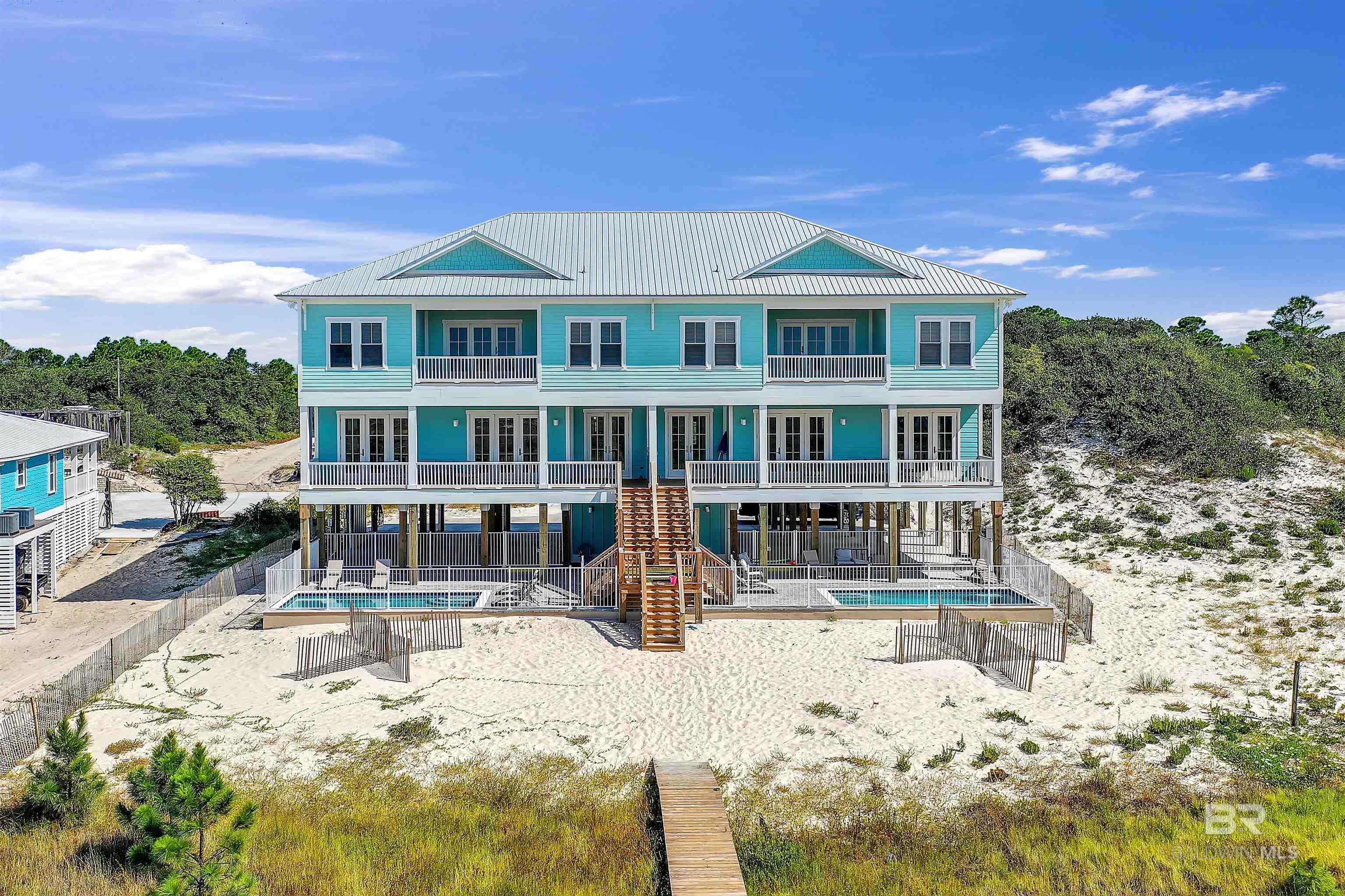 **SELLER IS OFFERING 2% SELLER CONCESSIONS WITH ACCEPTABLE OFFER AT CLOSING** Welcome to your private 100ft Gulf-front paradise in the peaceful community of Fort Morgan, Alabama! Nestled along the pristine shores of the Gulf of Mexico, this luxurious vacation rental duplex offers the perfect blend of comfort, convenience, and breathtaking views. With the capacity to accommodate a total of 32 guests, this duplex is an ideal choice for large groups, family reunions, or any special occasion. The duplex is situated right on the Gulf-front, providing unobstructed views of the sparkling waters. The property is designed as two identical, mirror-image units, each with its own private entrance with 6 bedrooms/6.5 bathrooms and a pool on each side. A private boardwalk leads directly to the 100ft private sandy shores, allowing guests easy access to the beach for sunbathing, swimming, and relaxing. Property is currently listed with a management company projected rentals are $350K rental projections. Fully Furnished! Buyer to verify all information during due diligence.