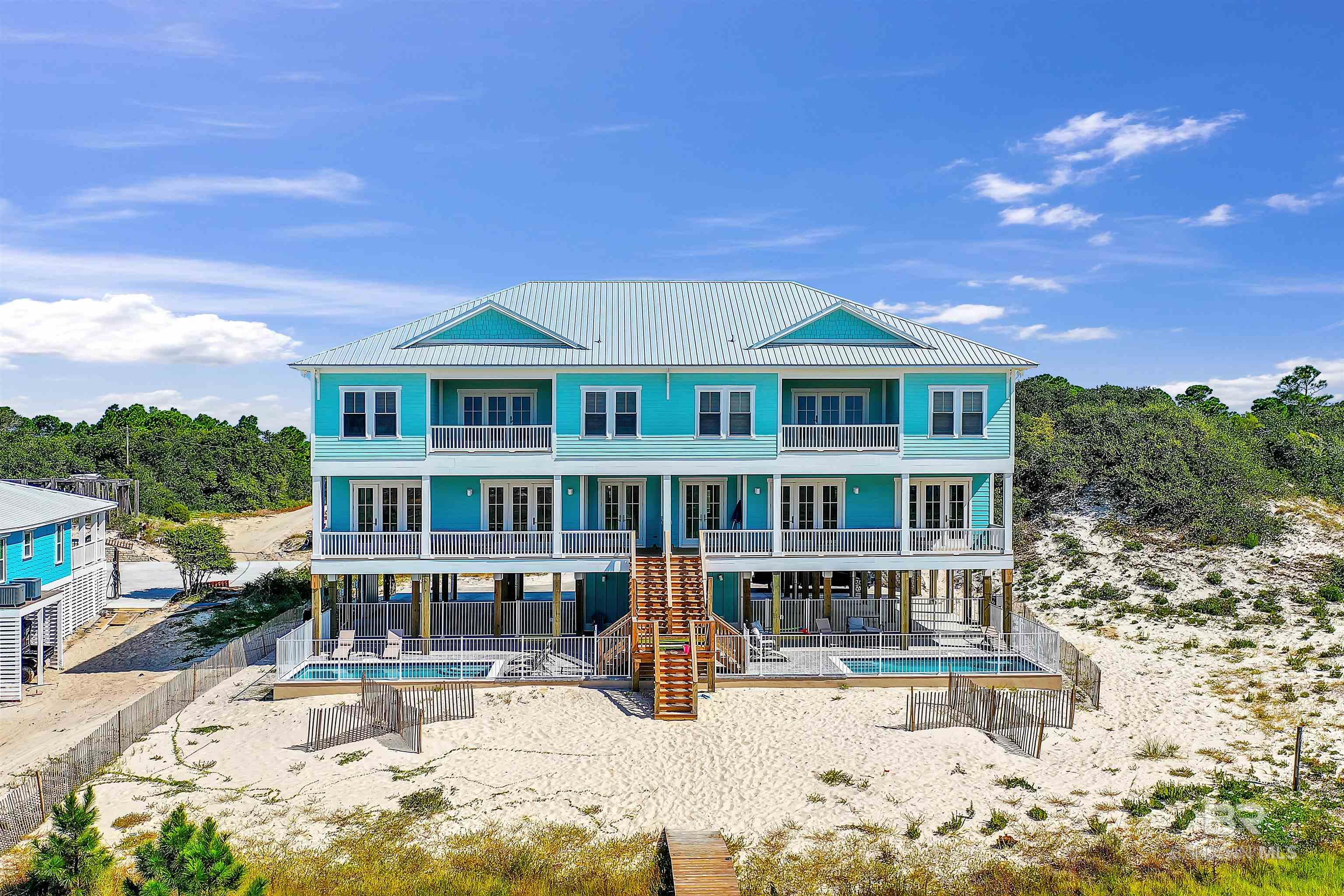 **SELLER IS OFFERING 2% SELLER CONCESSIONS WITH ACCEPTABLE OFFER AT CLOSING** Welcome to your private 100ft Gulf-front paradise in the peaceful community of Fort Morgan, Alabama! Nestled along the pristine shores of the Gulf of Mexico, this luxurious vacation rental duplex offers the perfect blend of comfort, convenience, and breathtaking views. With the capacity to accommodate a total of 32 guests, this duplex is an ideal choice for large groups or any special occasion. The duplex is situated right on the Gulf-front, providing unobstructed views of the sparkling waters. The property is designed as two identical, mirror-image units, each with its own private entrance with 6 bedrooms/6.5 bathrooms and a pool on each side. A private boardwalk leads directly to the 100ft private sandy shores, allowing guests easy access to the beach for sunbathing, swimming, and relaxing. Property is currently listed with a management company projected rentals are $350K rental projections. Fully Furnished! Buyer to verify all information during due diligence.