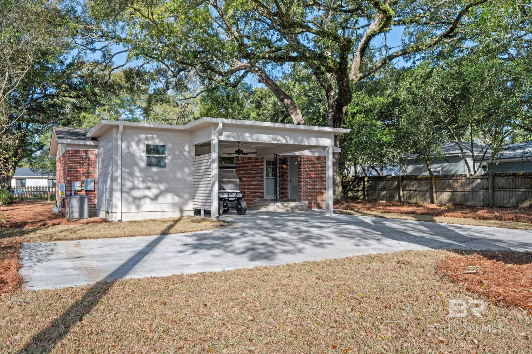 Welcome to Azalea!  Amazing location to walk or golf cart in downtown Fairhope! This DEEDED, completely remodeled cottage is in the heart of downtown Fairhope. This 2 bedroom, 2 bathroom PLUS dedicated laundry room has NEW Bruce solid white oak wood flooring, NEW hurricane impact windows throughout, NEW AC unit, NEW  tankless hot water heater, NEW exterior and interior paint, NEW insulation, NEW solid wood doors, NEW appliances, and the list continues!  The newly poured concrete driveway in the back provides access to your home from the alleyway behind Azalea Street AND a covered patio/carport area makes it convenient for you to enter your home from the back while your guests park in the new limestone driveway in the front.     From new pavers on the front and back porches to the newly remodeled kitchen with quartz countertops and ceramic tile backsplash, nothing has been overlooked. All listing details are to be considered approximate.   Call for your showing today! Buyer to verify all information during due diligence.