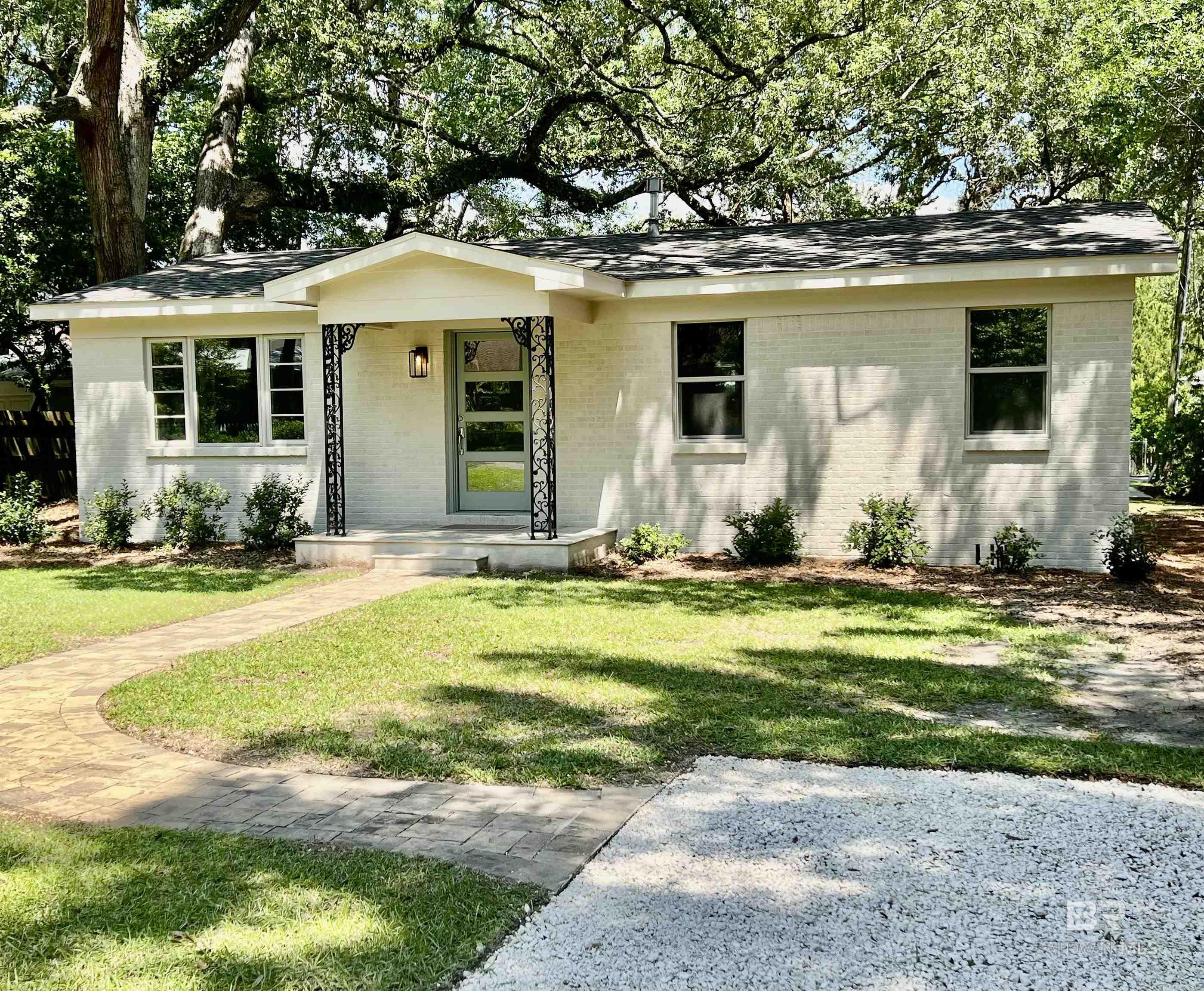 NEW ROOF (May 2025)! NEW EXTERIOR PAINT! ENTER FROM THE ALLEYWAY OR FROM AZALEA STREET! DEEDED and completely remodeled.  Amazing location on the North end of Azalea Street- walk or golf cart to the heart of downtown Fairhope!  Nothing has been overlooked. All listing details are to be considered approximate.   Call for your showing today! Buyer to verify all information during due diligence.