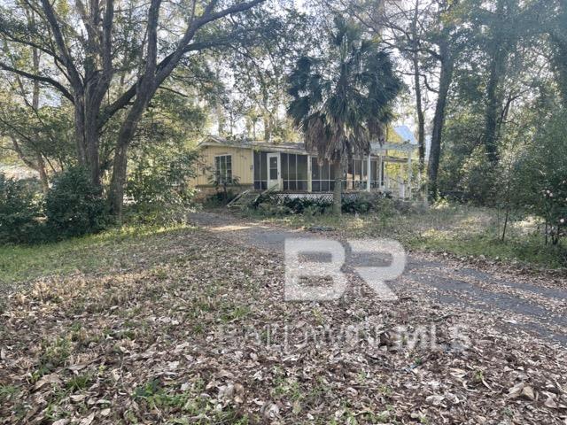 This is a beautiful property in historic Montrose with deeded beach/bay access FOR LIFE!  How would you like to be able to see those gorgeous sunrises and sunsets on your own property!  The house that is on here is a fixer upper and is sold AS IS! Buyer to verify all information during due diligence.