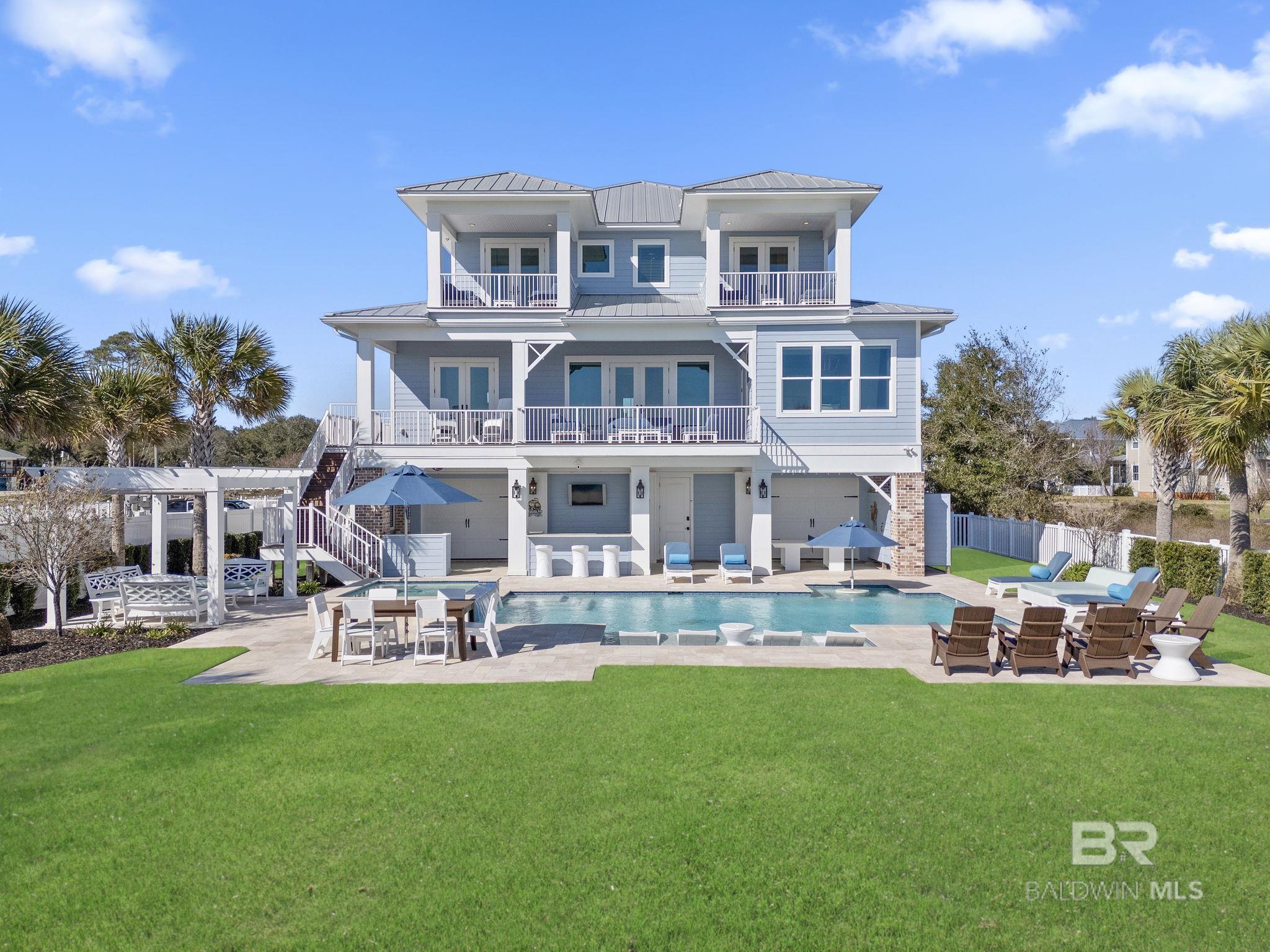 Welcome to Mermaid Cove! This 3319sf luxurious coastal retreat is located in the cottage district of Landfall Subdivision. Completed in 2021, nodetail has been overlooked! You'll find a welcoming entrance that lead you to appreciate the backyard retreat w/ private beach, private marina boatslip, & endless views of the ICW & Gulf of Mexico. The meticulously maintained lawn & landscaping that encompasses the property, provides thefinishing touches for the true star of the show, the back yard oasis! You can entertain your guests year round, or have that sunset mixer from theprofessionally designed furniture & lounge areas on the balconies, at the wet bar, on the travertine pool deck, or in the 650sf. heated, gunite poolwith oversized spa, or under the pergola. The private beach overlooks the marina, & also provides an area to not only relax, but also provides an entry point for kayaks, paddleboards, & presents itself to wonderful fishing in the grass beds beyond. The interior contains 5 bedrooms, 3 full baths, separate office, top of the line elevator, butlers pantry, drink station, 3rd story coffee bar, & 2 private bedroom balconies. Finishing touches include cased & crowned windows, 8' solid core doors, crown molding throughout, coffered ceilings, wainscoting, judges paneling, smart home tech, security system, & surround sound/speakers. Kitchen is appointed w/ lighted, custom cabinets, quartz counters, Wolf cooktop, Kitchenaid SS appliances, & ice maker. All baths have custom tile showers & seamless glass. Primary has a separate soaking tub w/ dual vanities, & separate water closet & bidet. Exterior has impact rated PGT windows & Neuma doors, standing seam metal roof, Hardi siding, trex deck, powder coated railings, CopperSmith lights & home generator. Landfall is a private community w/ a private marina & gazebo, and is the closest marina to Pensacola Pass, Ft. McRee, & Johnson's Beach. Home is offered fully furnished, and comes with a boat slip/14k boat lift. Buyer