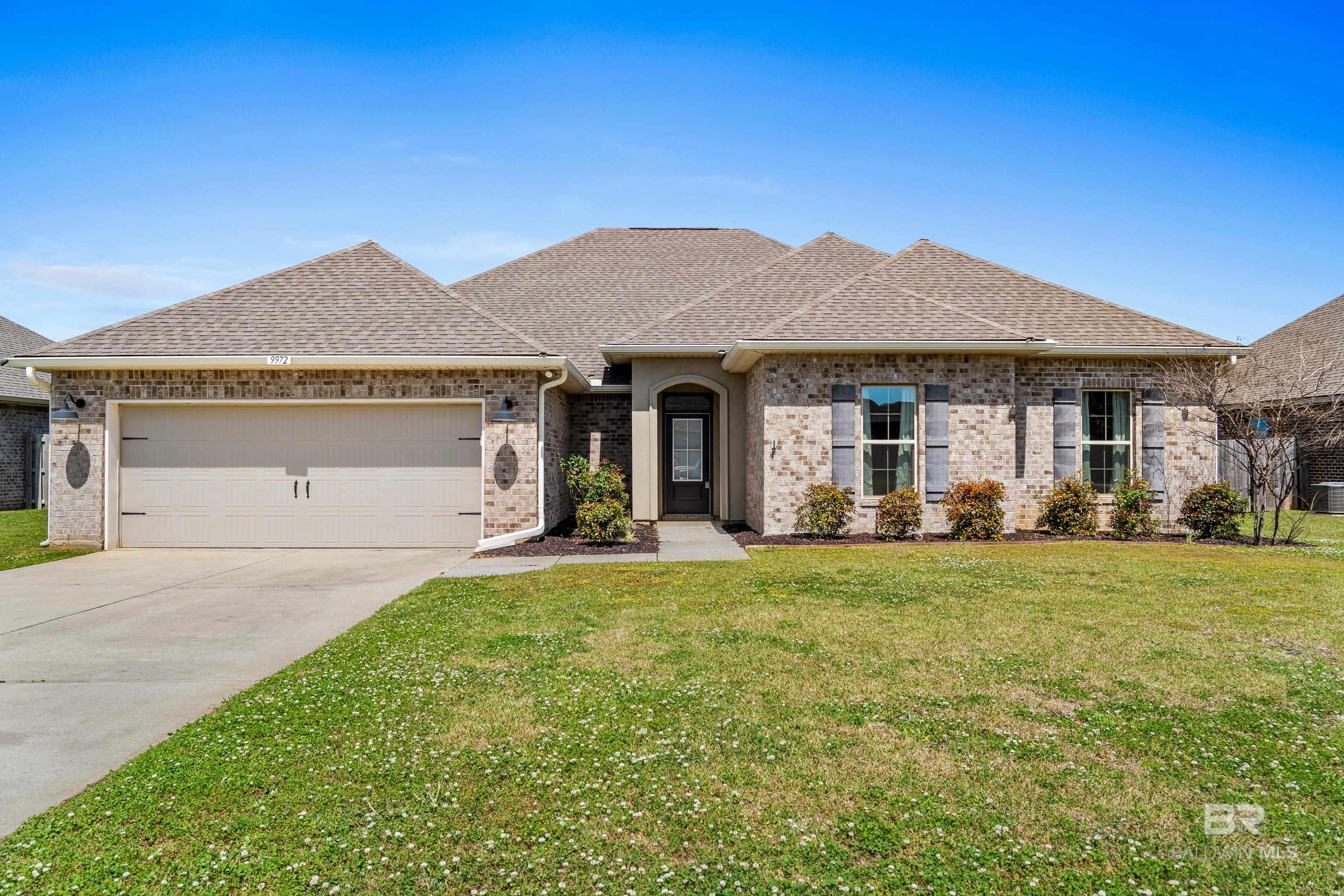 Located in Daphne, Al and central to all that Baldwin Co. has to offer,  this all-brick, four-bedroom, two-bath LAKEFRONT home is move in ready. This well-maintained property boasts numerous custom features and unique upgrades that set it apart from other homes in its price range.The open, split floor plan offers spacious living areas and enhanced privacy for the primary bedroom, which includes tall tray ceilings, abundant natural light, and an en-suite bathroom. The primary bathroom is equipped with quartz countertops, double vanities and sinks, a private toilet area, and a large walk-in shower. The expansive walk-in closet includes custom shelving, and for added convenience, the laundry room is directly accessible from the primary bedroom closet.Additional highlights include:*Tankless hot water heater newly installed 2024 *Whole house generator *Durable, wood looking tile flooring throughout.*A gas fireplace in the living room, with custom storage and cabinets* A chef's kitchen with quartz countertops, a butler's pantry, painted cabinets, a gas range, stainless steel appliances (including a refrigerator and dishwasher)* A morning room/dining area featuring a deep kitchen sink, beautiful lighting fixtures, ample cabinets and complete with a coffee and wine barOutside, you'll find a beautifully landscaped yard with a screened-in back porch that leads to a concrete patio, a large storage shed and a fully fenced backyard which all adds to the property's appeal.  There's also plenty of room to add a pool in the backyard if the future owner desires. Buyer to verify all information during due diligence.