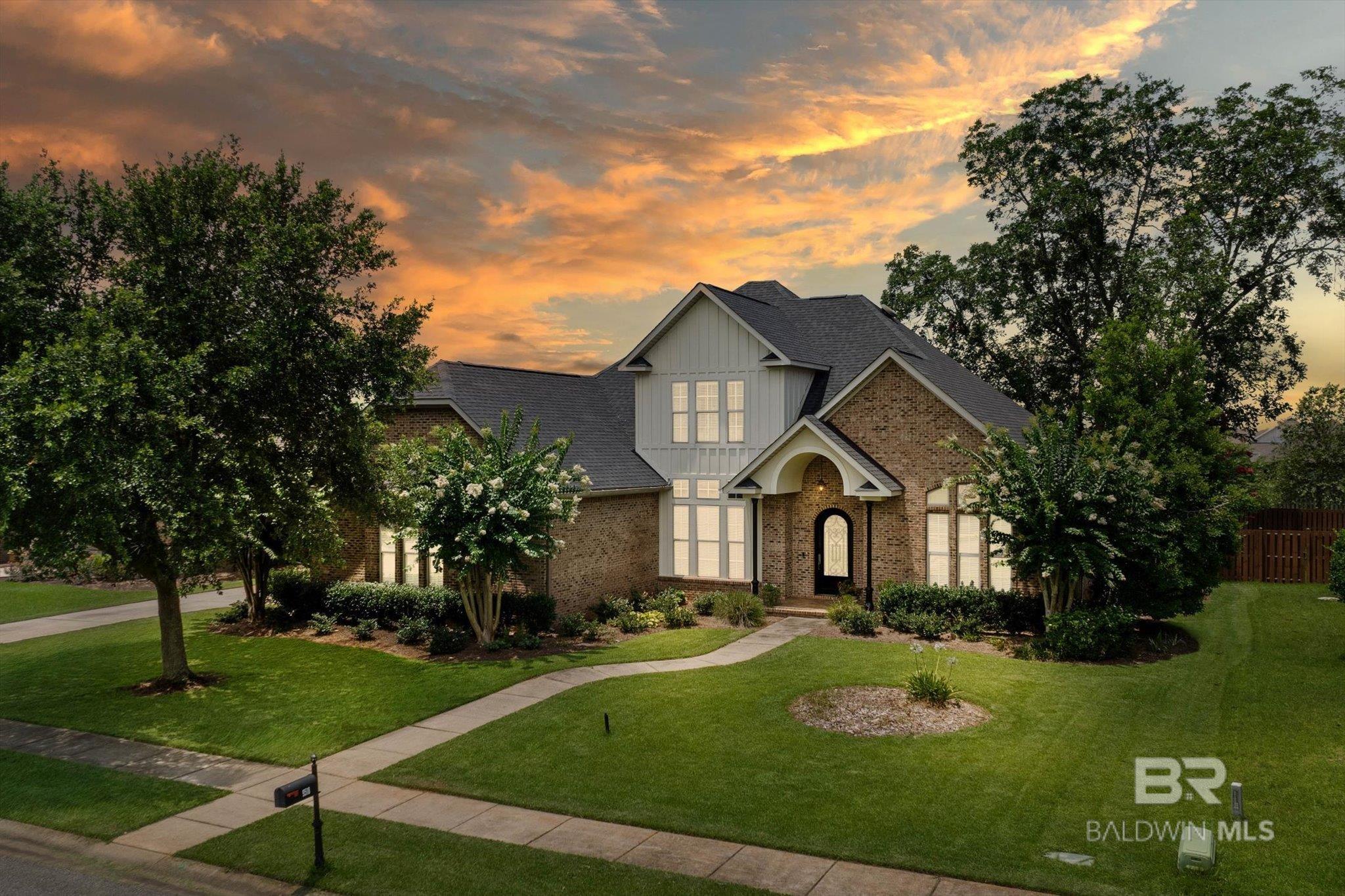 Welcome to this beautifully designed custom brick residence located in the highly sought after Bellaton community. Offering 4 bedrooms and 3.5 baths across 3,669 square feet, this home blends timeless elegance with modern luxury. Impeccable details abound, including rich hardwood flooring throughout, 12-foot ceilings in the living room, 14-foot ceilings in the formal dining room, solid 8-foot interior doors, and a dramatic barrel ceiling in the foyer. Step outside to your private outdoor retreat featuring a spacious screened-in lanai that encloses a beautiful gunite saltwater pool and offers a seamless extension of the home's living space. Complete with a pool house and two covered patio areas, it’s the perfect setting for both relaxed lounging and entertaining. The spacious primary suite features a serene sitting area, while the spa-inspired primary bath includes a spectacular circular walk-through shower. A pocket office on the main level offers a quiet space to work or study, and two large floored attic spaces provide generous storage. Additional features include a full-house generator,  fortified roof (2021), and a security system with camera—offering comfort, security, and peace of mind. Recent upgrades ensure long-term value and efficiency, including three new Trane HVAC units (one in 2023, two in 2025—all with 10-year warranties). All interior and exterior ceiling fans, as well as all interior door hardware, were replaced in 2022. The gourmet kitchen is equipped with top-tier appliances: KitchenAid gas cooktop (2021), Frigidaire Gallery refrigerator (2021), Miele dishwasher (2024), and Frigidaire Gallery microwave (2024). The oversized double garage easily accommodates two vehicles plus a golf cart. This exceptional property offers a perfect blend of luxury, comfort, and functionality. Schedule your private showing today to experience the exceptional quality and lifestyle this home offers. Owner is a licensed real estate agent in the state of Alabama.  Buyer