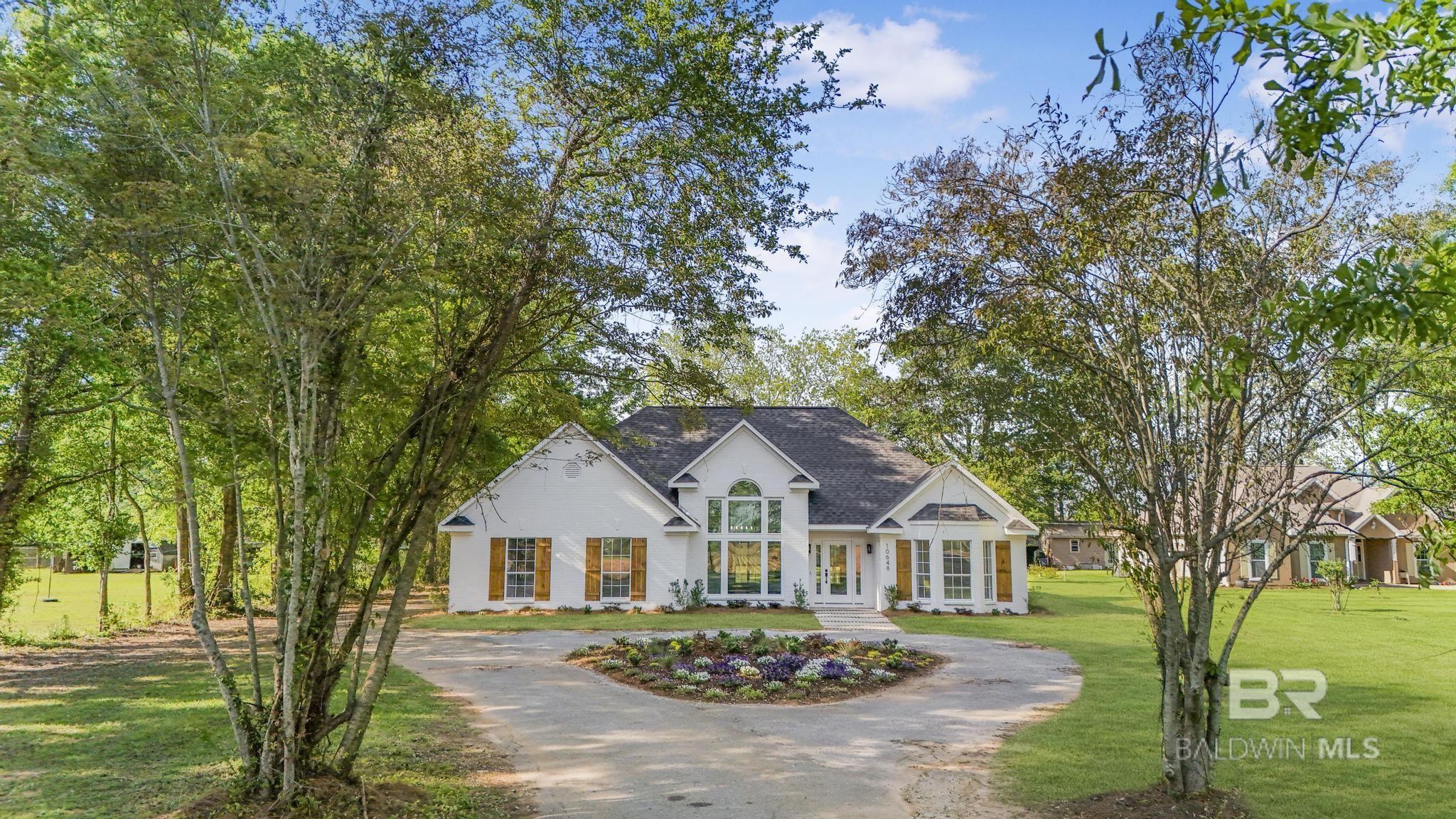 Welcome to this stunning custom-built home on just under an acre, and no HOA! Thoughtfully designed and beautifully updated, this property offers a perfect blend of luxury and functionality. With 4 bedrooms, 2 full bathrooms, and a dedicated office that could easily serve as a 5th bedroom or flex space, there's room for everyone. Inside, you’ll find quartz countertops, custom cabinetry, brand-new appliances, a cozy electric fireplace, and a separate dining area perfect for entertaining. The primary suite is a true retreat with a custom tile shower, soaking tub, and a spacious walk-in closet. Step outside to your backyard oasis—complete with a brand-new outdoor kitchen featuring a built-in grill, sink, storage, and a covered patio with a stained tongue-and-groove ceiling and a built-in outdoor fireplace. Additional highlights include a new roof, new plumbing with a manifold system, lush landscaping, and an oversized carport for ample covered parking. You’ll be proud to call this gorgeous property home—schedule your private tour today! Buyer to verify all information during due diligence.
