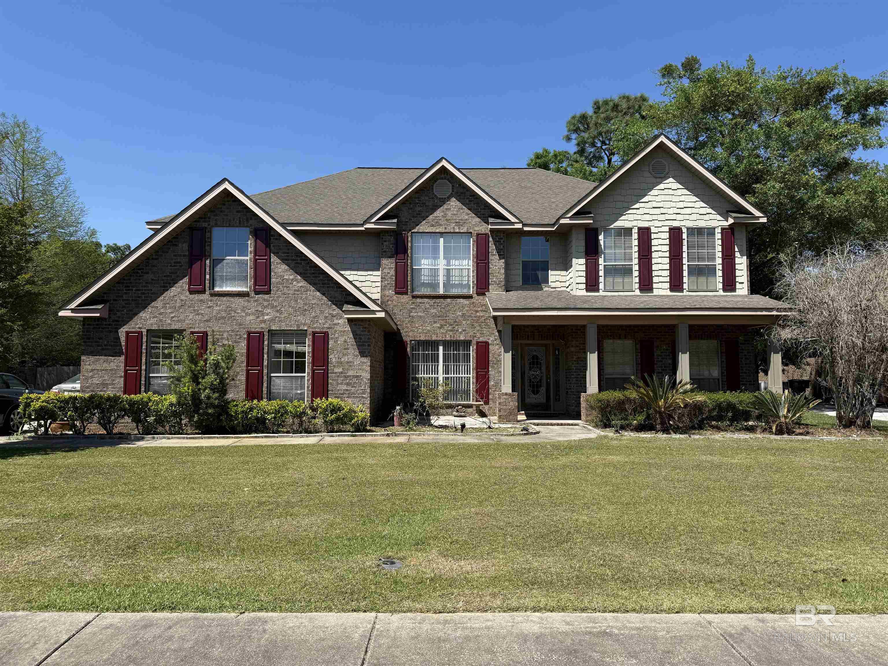 Prime Location & Spacious Living in Daphne!Welcome to this beautifully designed 6-bedroom, 3.5-bath home offering over 4,200 square feet of thoughtfully planned living space. Built in late 2011 and situated in a quiet subdivision of fewer than 10 homes, this property offers exceptional convenience—right next to Daphne High School and just minutes from major highways (US-98, US-90, US-181) and I-10, with easy access to shopping, dining, and local amenities. The first floor features a spacious primary suite for added privacy, while the second floor includes five additional bedrooms and a versatile bonus room—perfect for a home office, study space, or media room. Upon entering, you're welcomed by a charming keeping room and a formal dining area that flows into the expansive great room, highlighted by eight windows and a cozy fireplace.The kitchen is a chef’s dream, featuring abundant cabinetry, a pantry, granite countertops, a hop bar, and a center island. It opens to the breakfast area and great room, creating a seamless layout for everyday living and entertaining. Double French doors lead to a large backyard with plenty of room to enjoy outdoor living. Situated on a 0.35-acre lot with only one adjacent neighbor, this home also includes a front porch and back patio—ideal for relaxing or hosting. With flexible living spaces and room to grow, this home is ready to meet the needs of modern lifestyles, whether you're working remotely, learning virtually, or simply looking for more space to spread out. Buyer to verify all information during due diligence.