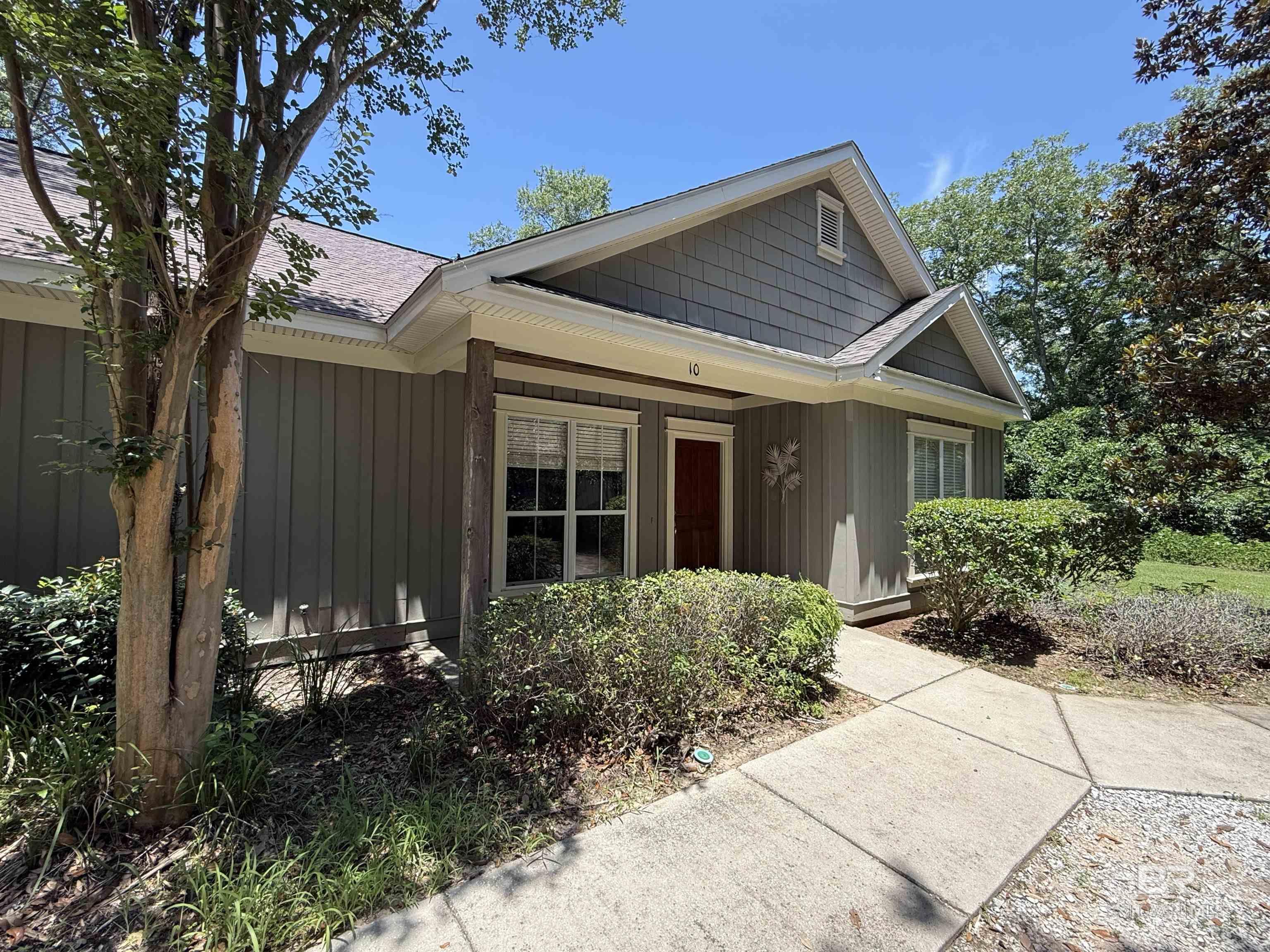 Welcome to easy living in the lovely Fairhope, AL ! This charming 2 bedroom, 2 bathroom condominium Unit 10, offers a spacious, open-concept floorplan all on one level—perfect for comfort and convenience. The custom kitchen features elegant granite countertops and custom cabinets, ideal for cooking and entertaining. As an end unit, you'll enjoy added privacy with no neighbors on one side and a larger backyard. Majestic oak trees create a serene, shaded retreat on the grounds. Nestled in a quiet, well-maintained community of only 14 units and located just minutes from the Southern Living Magazine-featured downtown Fairhope, this home puts you close to shopping, dining, and the bayfront charm that makes this area so special. Don’t miss this rare opportunity to own a slice of Fairhope paradise! Buyer to verify all information during due diligence. Seller offering $1,000 Carpet Credit. Fairly new Washer and Dryer will convey ($1,500 new).
