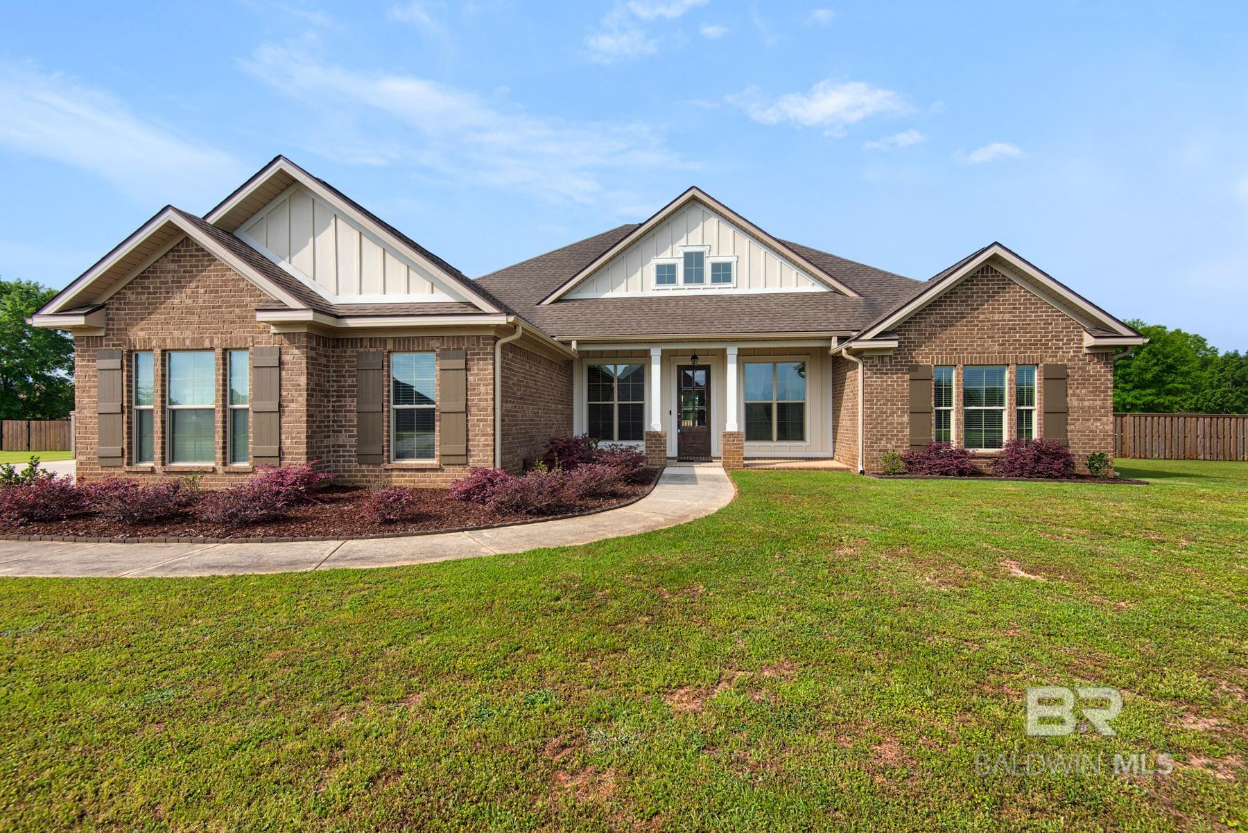 Don't miss this beautifully upgraded residence offering both luxury and functionality on a spacious lot with no rear neighbors. This 5-bedroom, 3-bathroom split floor plan features a single-level layout designed for comfortable living. The open-concept kitchen is a chef’s dream, showcasing custom cabinetry, granite countertops, a large island, a tiled backsplash, and stainless steel appliances including a KitchenAid 5-burner gas range. The great room boasts elegant painted built-ins, while wood flooring brings warmth to the master suite, dining area, and main living spaces. Tile laid on the diagonal adds a designer touch throughout the home, and all bathrooms feature custom tiled surrounds. Thoughtful attention to detail is evident throughout. Located on an oversized lot and in excellent condition, this home offers style, comfort, and peace of mind. Don’t miss your chance to own this exceptional property.  Buyer to verify all information during due diligence. Flooring allowance offered
