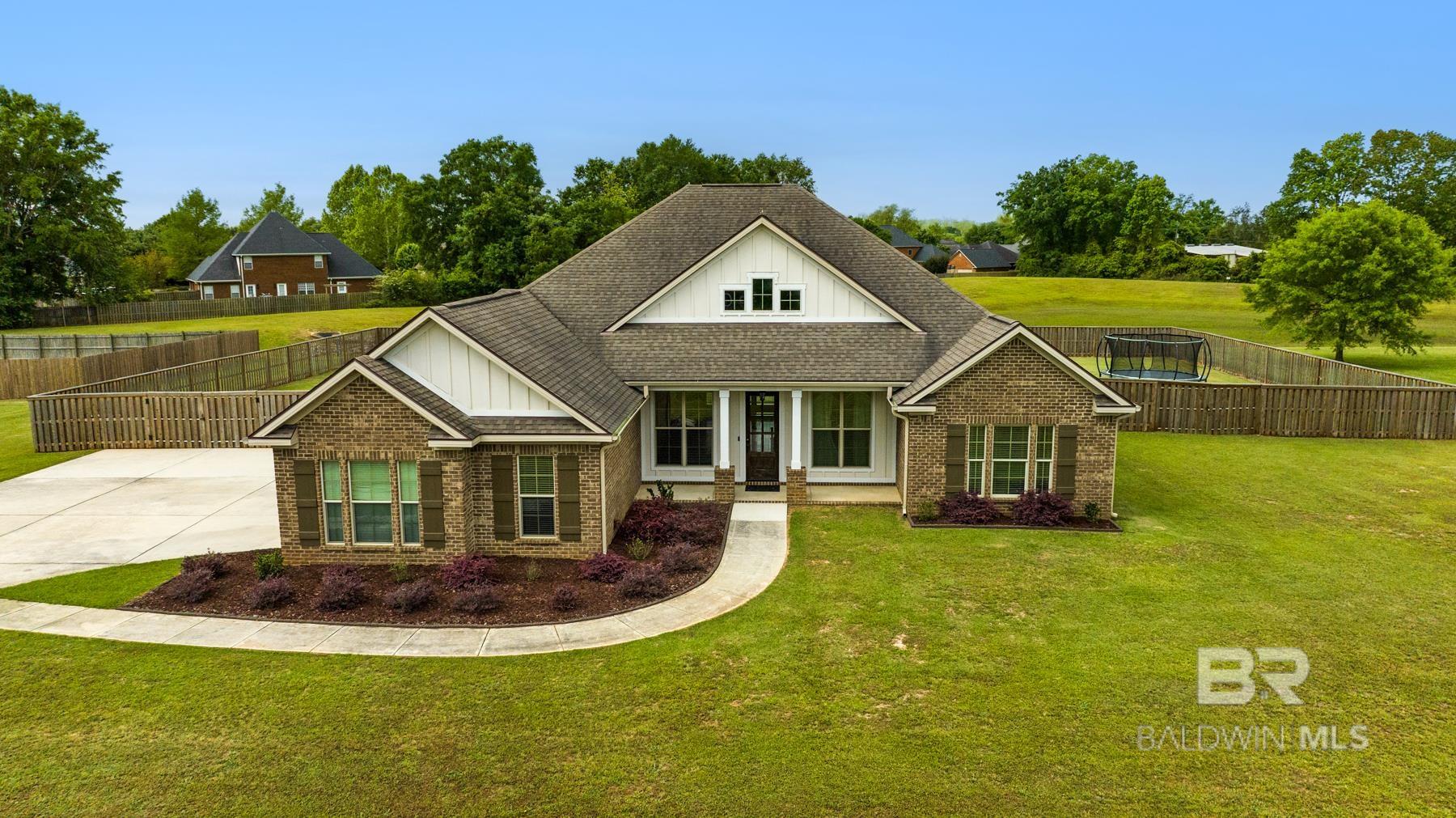 Don't miss this beautifully upgraded residence offering both luxury and functionality on a spacious lot with no rear neighbors. This 5-bedroom, 3-bathroom split floor plan features a single-level layout designed for comfortable living. The open-concept kitchen is a chef’s dream, showcasing custom cabinetry, granite countertops, a large island, a tiled backsplash, and stainless steel appliances including a KitchenAid 5-burner gas range. The great room boasts elegant painted built-ins, while wood flooring brings warmth to the master suite, dining area, and main living spaces. Tile laid on the diagonal adds a designer touch throughout the home, and all bathrooms feature custom tiled surrounds. Thoughtful attention to detail is evident throughout. Located on an oversized lot and in excellent condition, this home offers style, comfort, and peace of mind. Don’t miss your chance to own this exceptional property.  Buyer to verify all information during due diligence. Flooring allowance offered